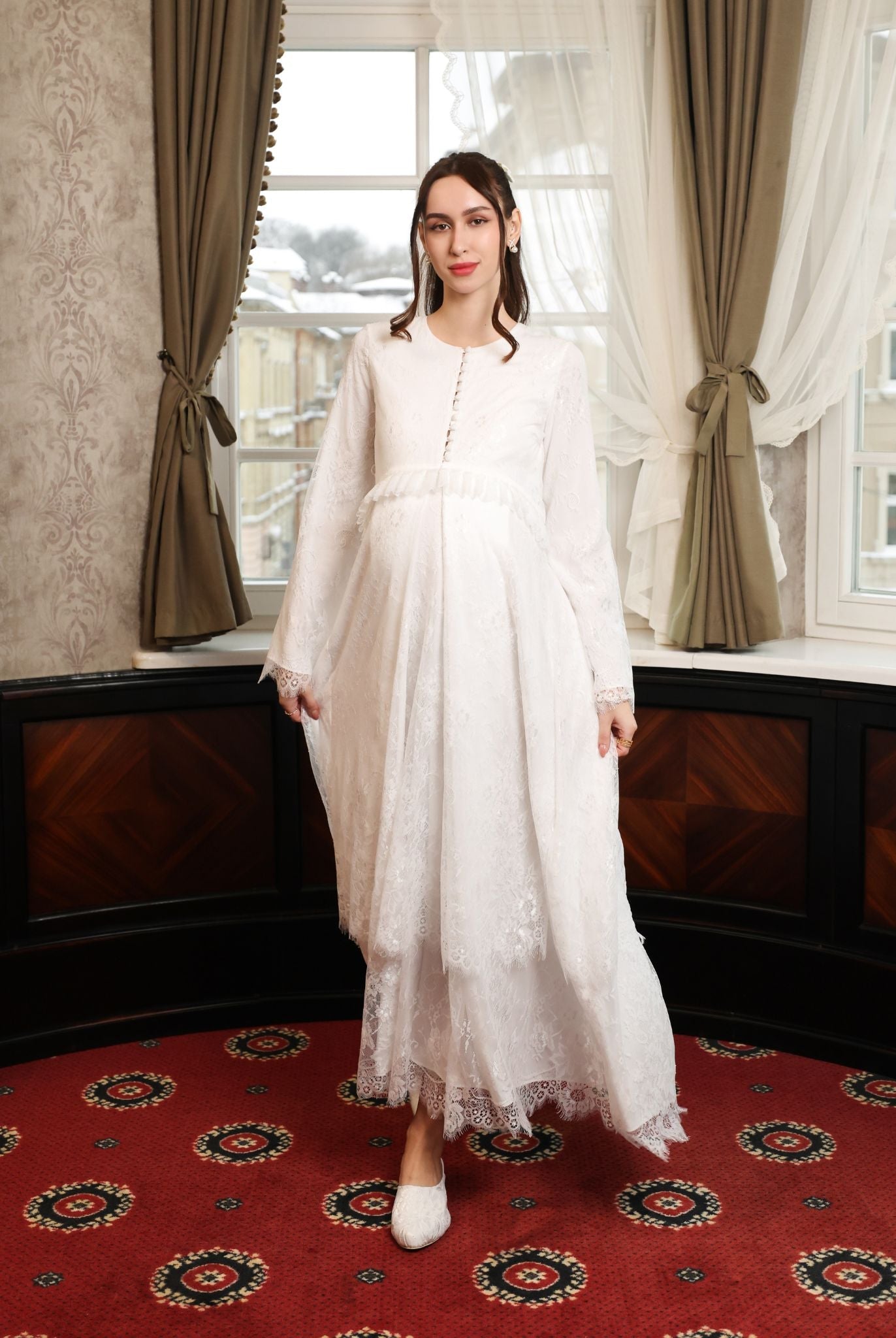 A dynamic view of the floor-length gown in motion, illustrating the weightless and fluid movement of the lace layers.