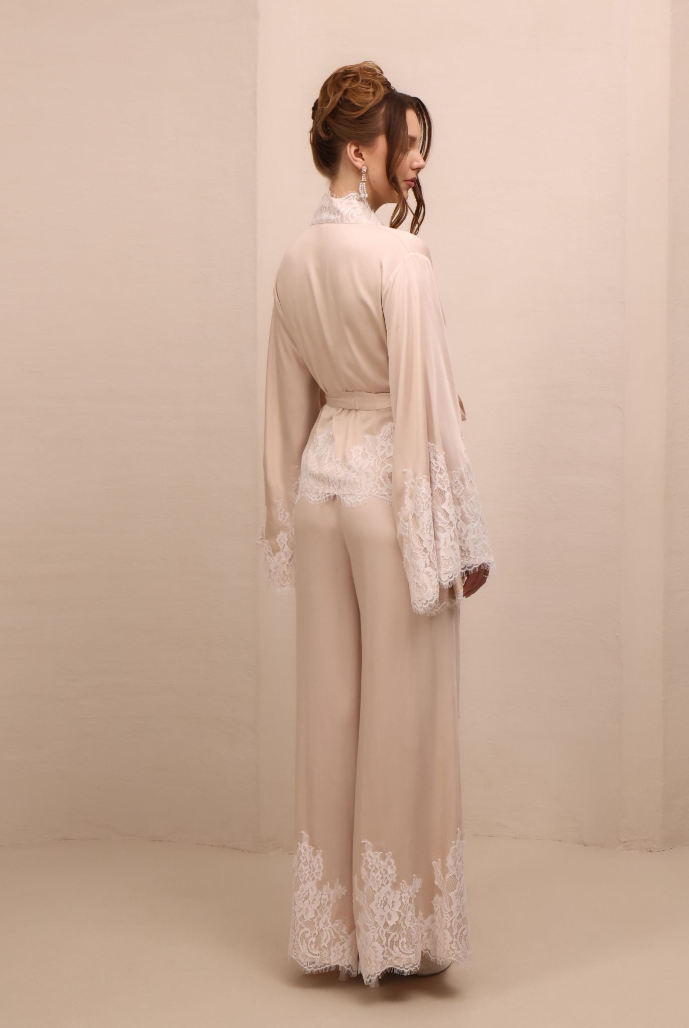 Rear view of the kimono-style ensemble, highlighting the long, clean lines and the smooth fall of the wide-leg pants.