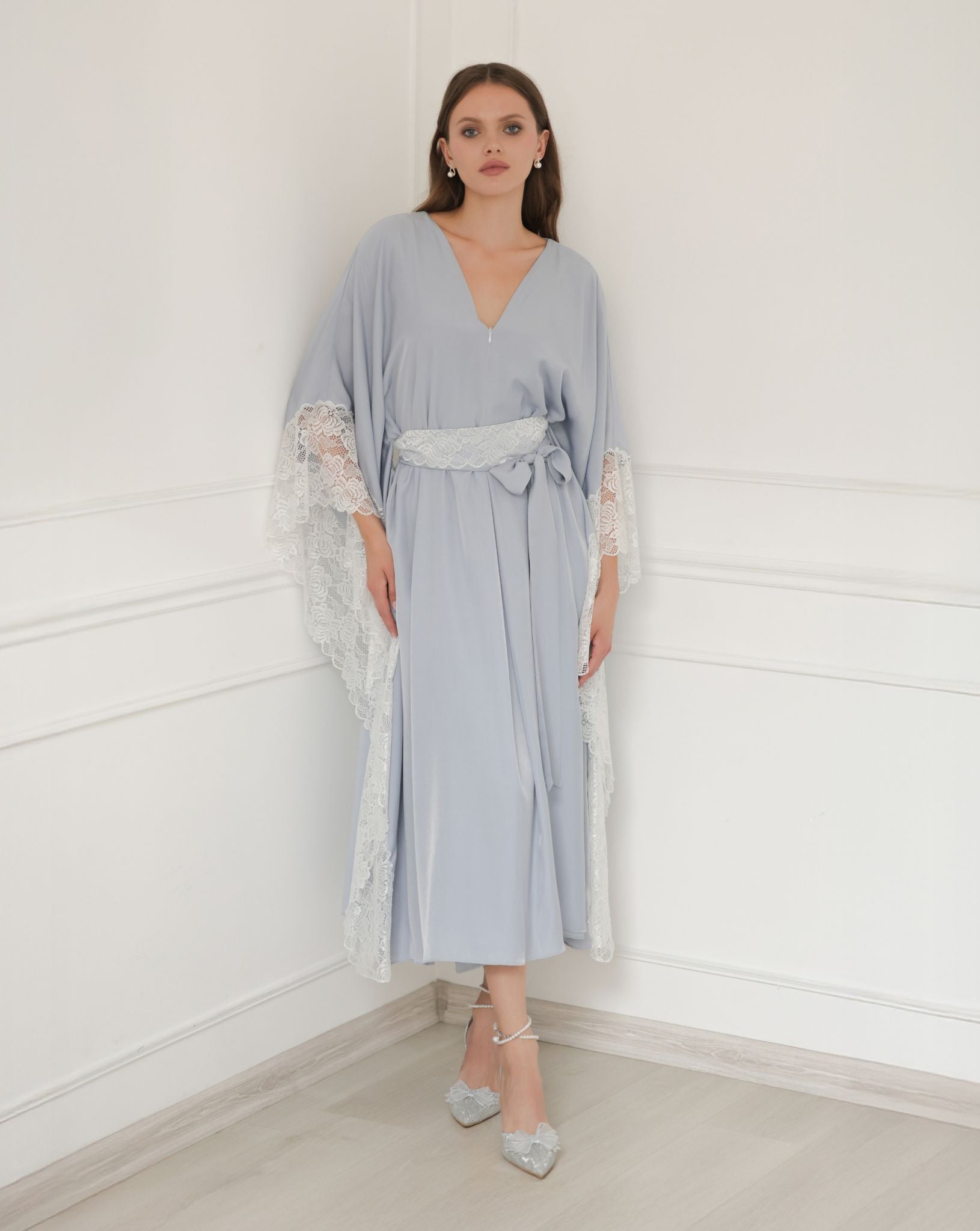 Maternity dress with lace sleeve detail and empire waist, perfect for elegant comfort.