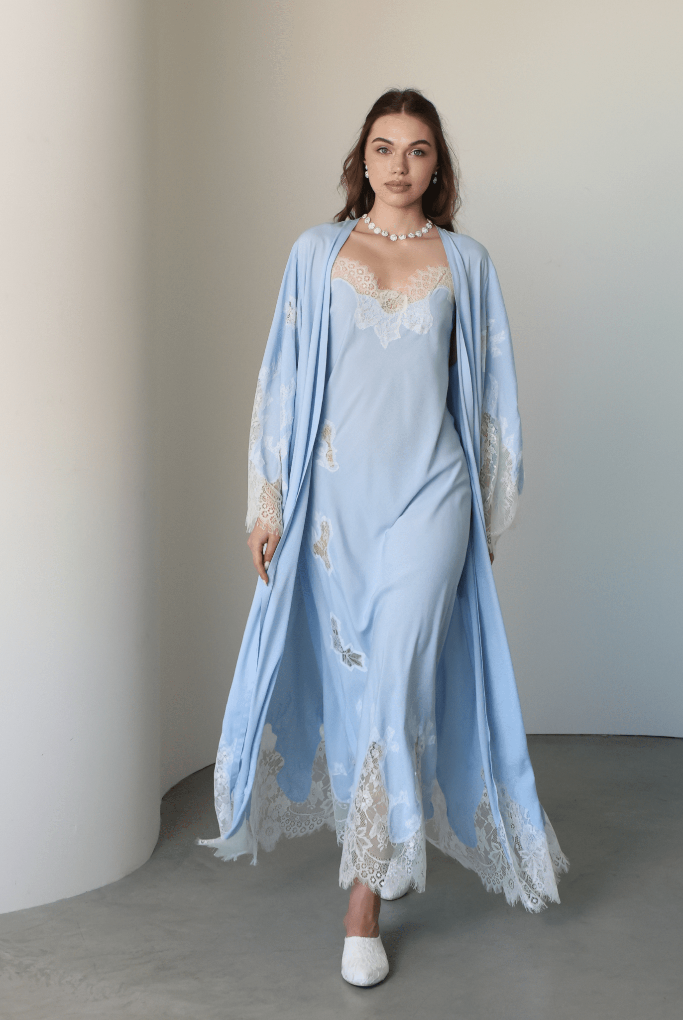 A full-length motion shot of the Robe and Nightgown Set, capturing the soft, structured drape of high-quality cotton.