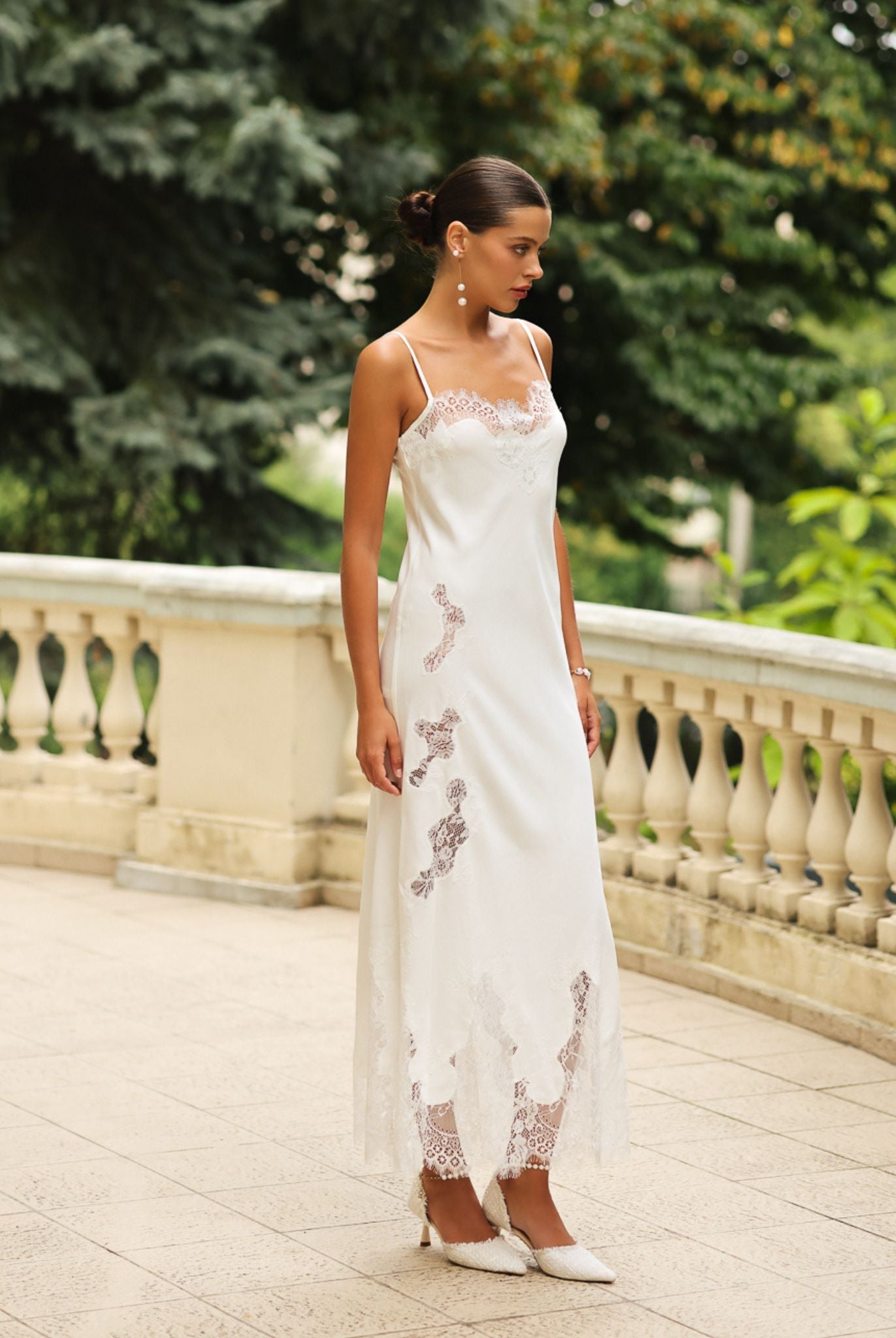 Side view of the cotton nightdress, highlighting the artistic lace cutouts and the soft, breathable silhouette.