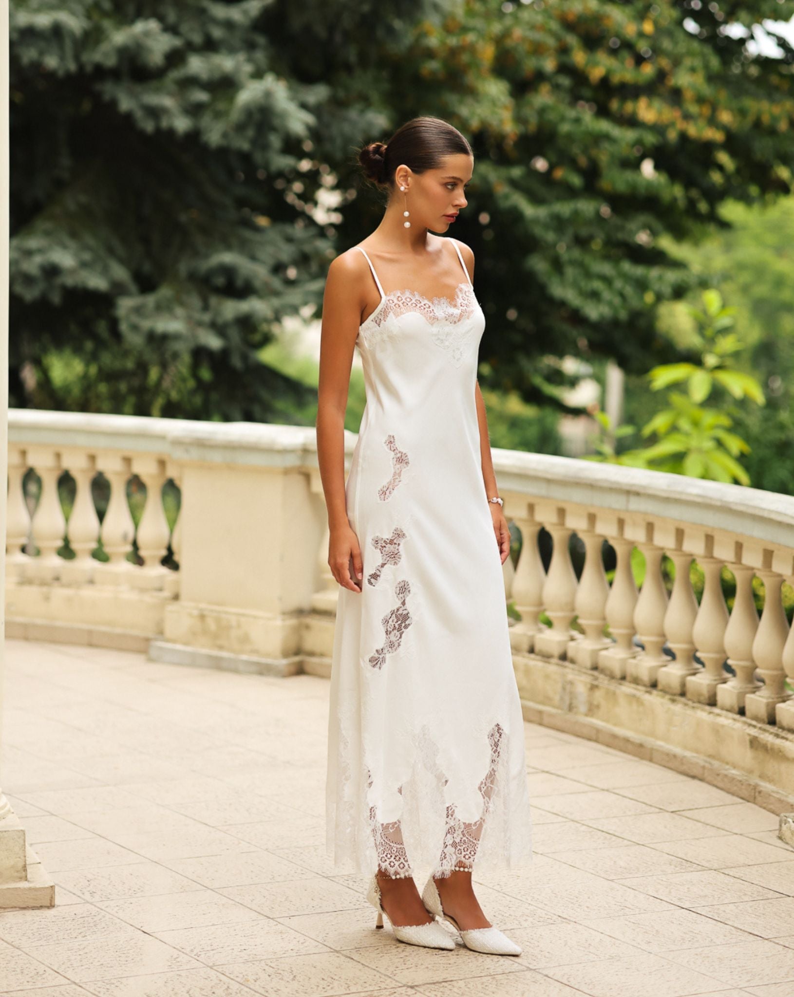 Side view of the cotton nightdress, highlighting the artistic lace cutouts and the soft, breathable silhouette.