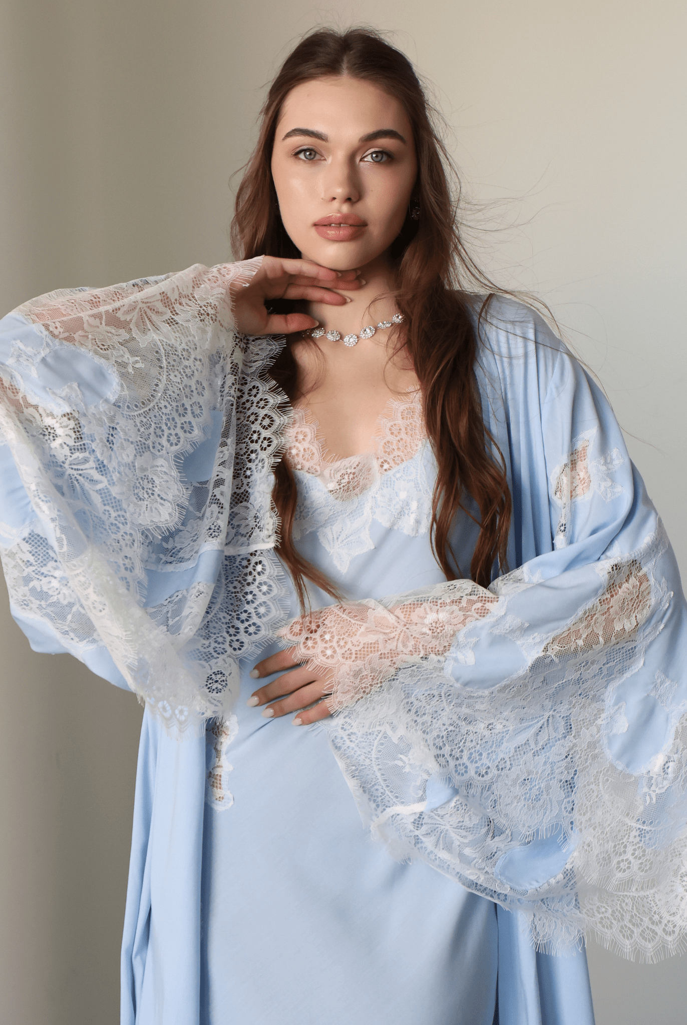Mid-length shot of the Robe and Nightgown Set, focusing on the contemporary luxury and refined lace embellishments.
