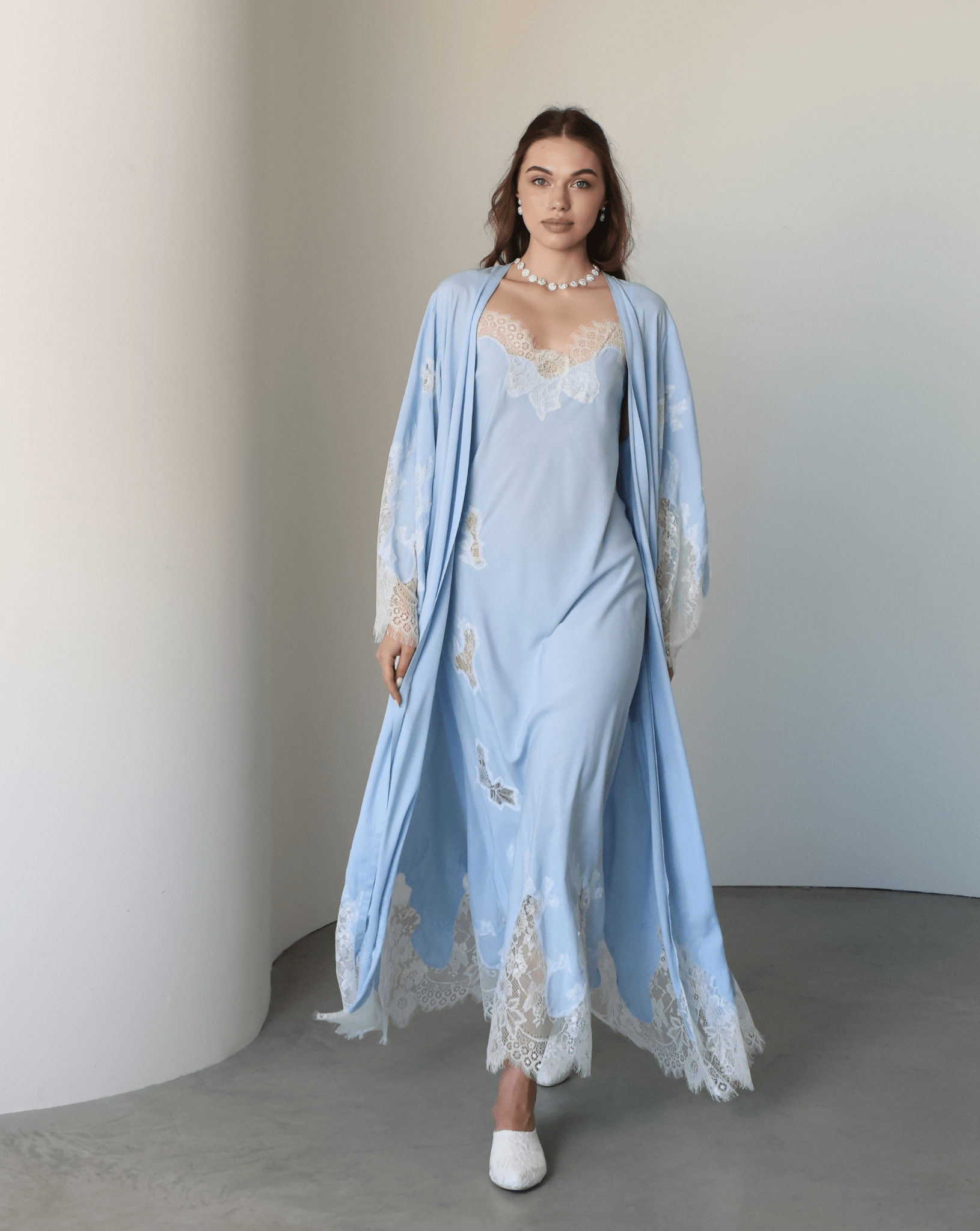 A full-length motion shot of the Robe and Nightgown Set, capturing the soft, structured drape of high-quality cotton.
