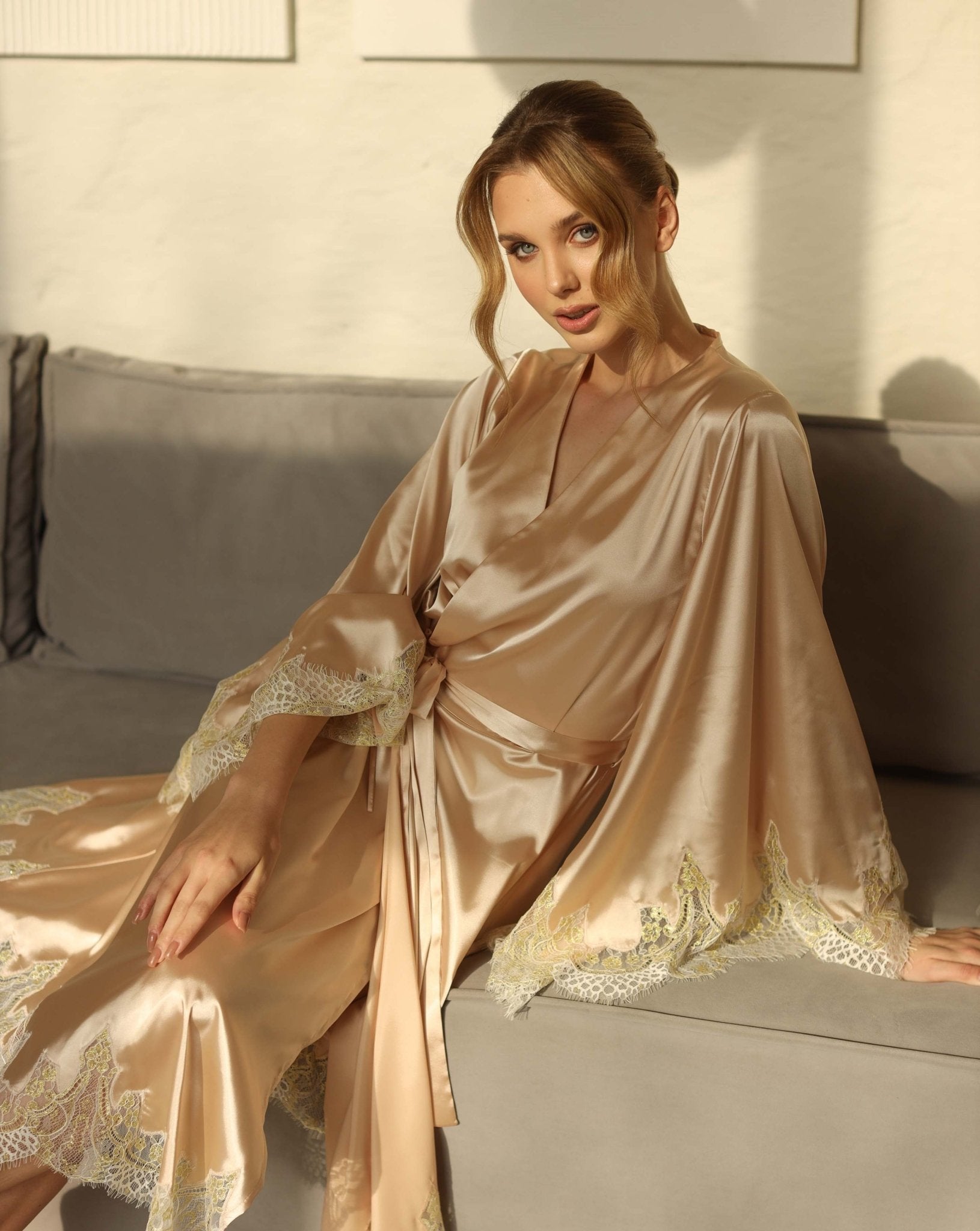 Model wearing champagne satin hostess robe with lace trim – Kafemme