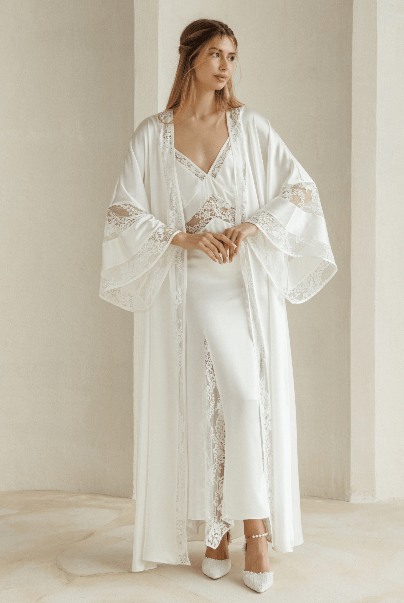 Model wearing Inamorata Silk Robe and Nightgown Set in ivory satin with lace trim