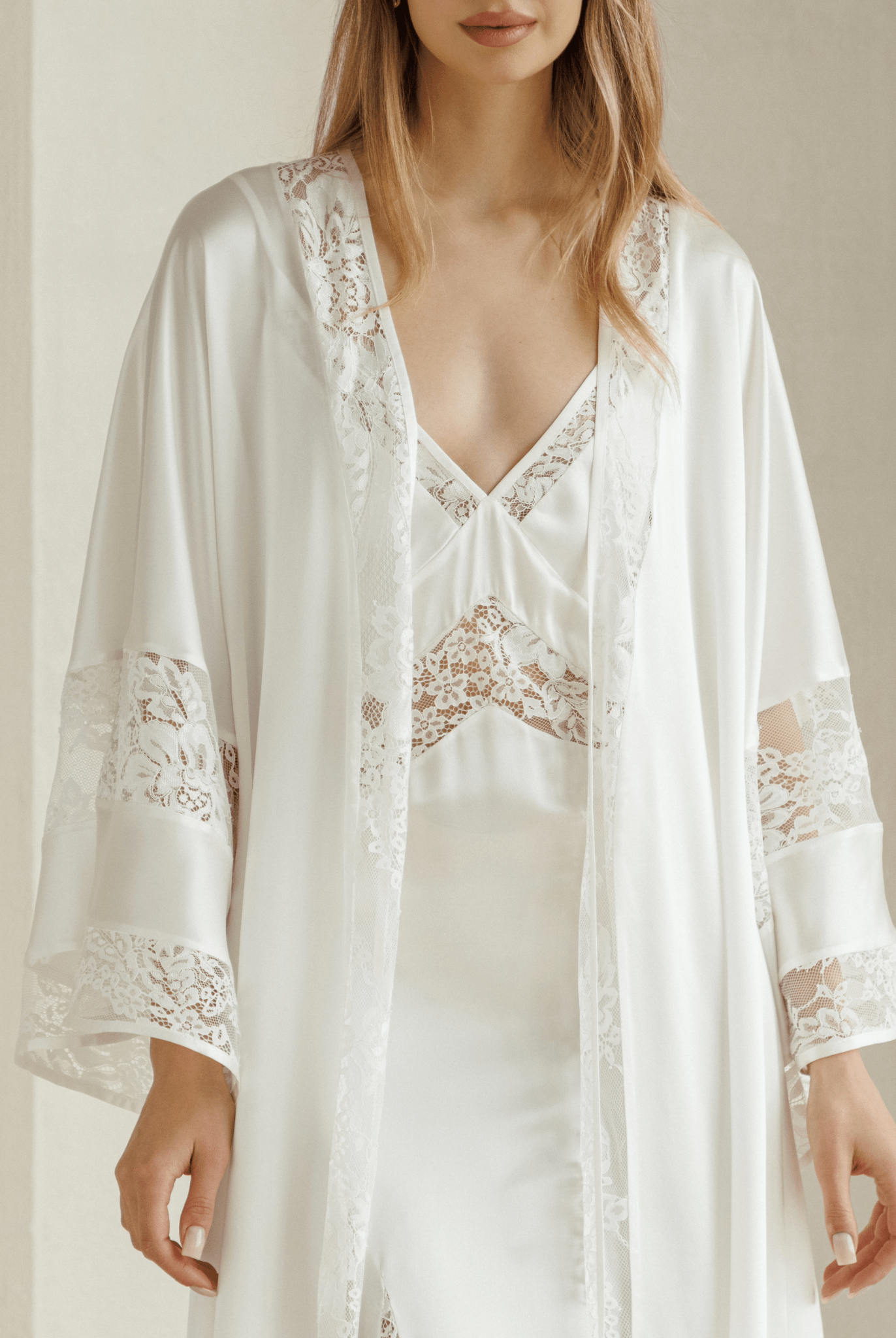 Open silk robe with sheer lace panels styled over coordinating nightgown