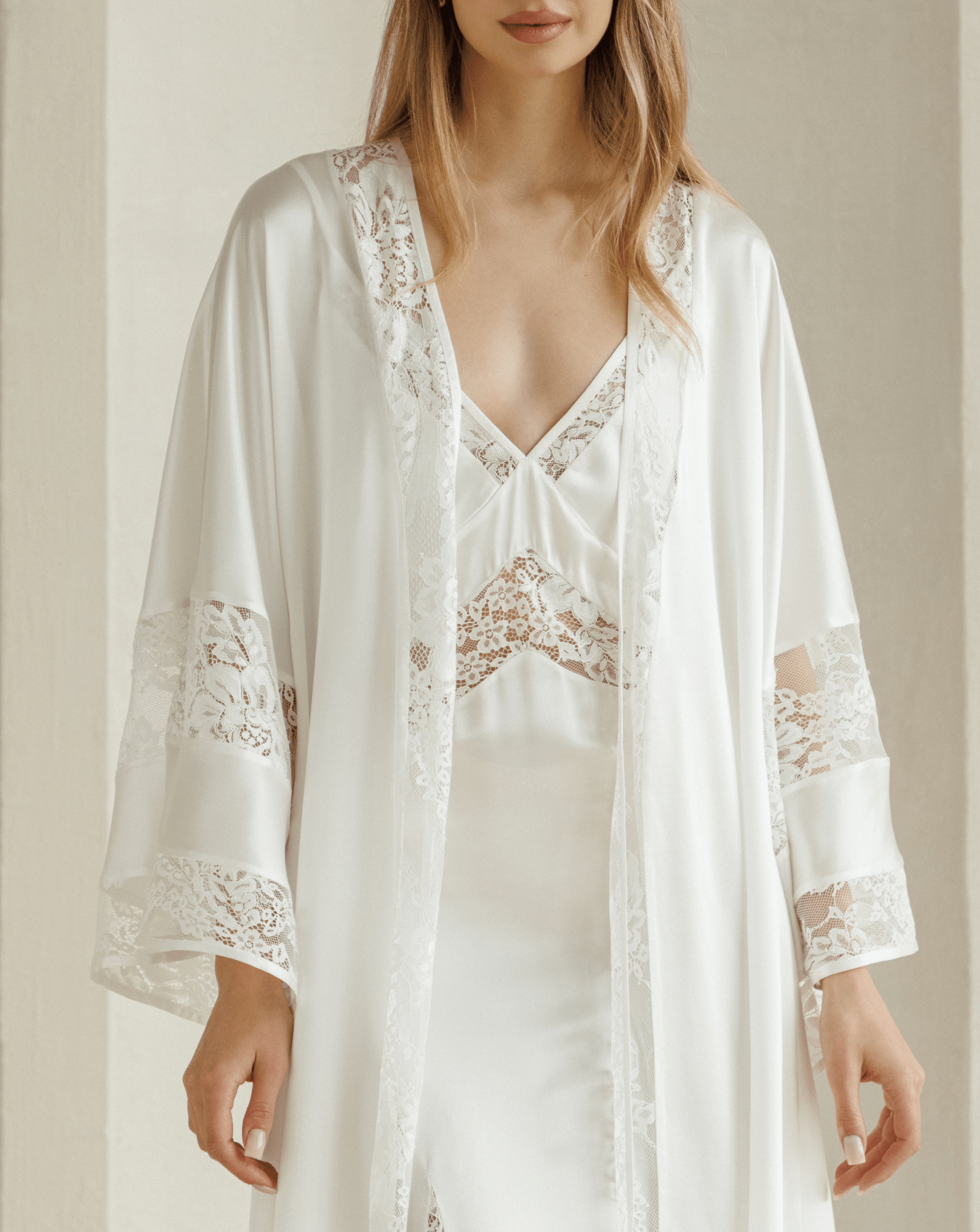 Open silk robe with sheer lace panels styled over coordinating nightgown