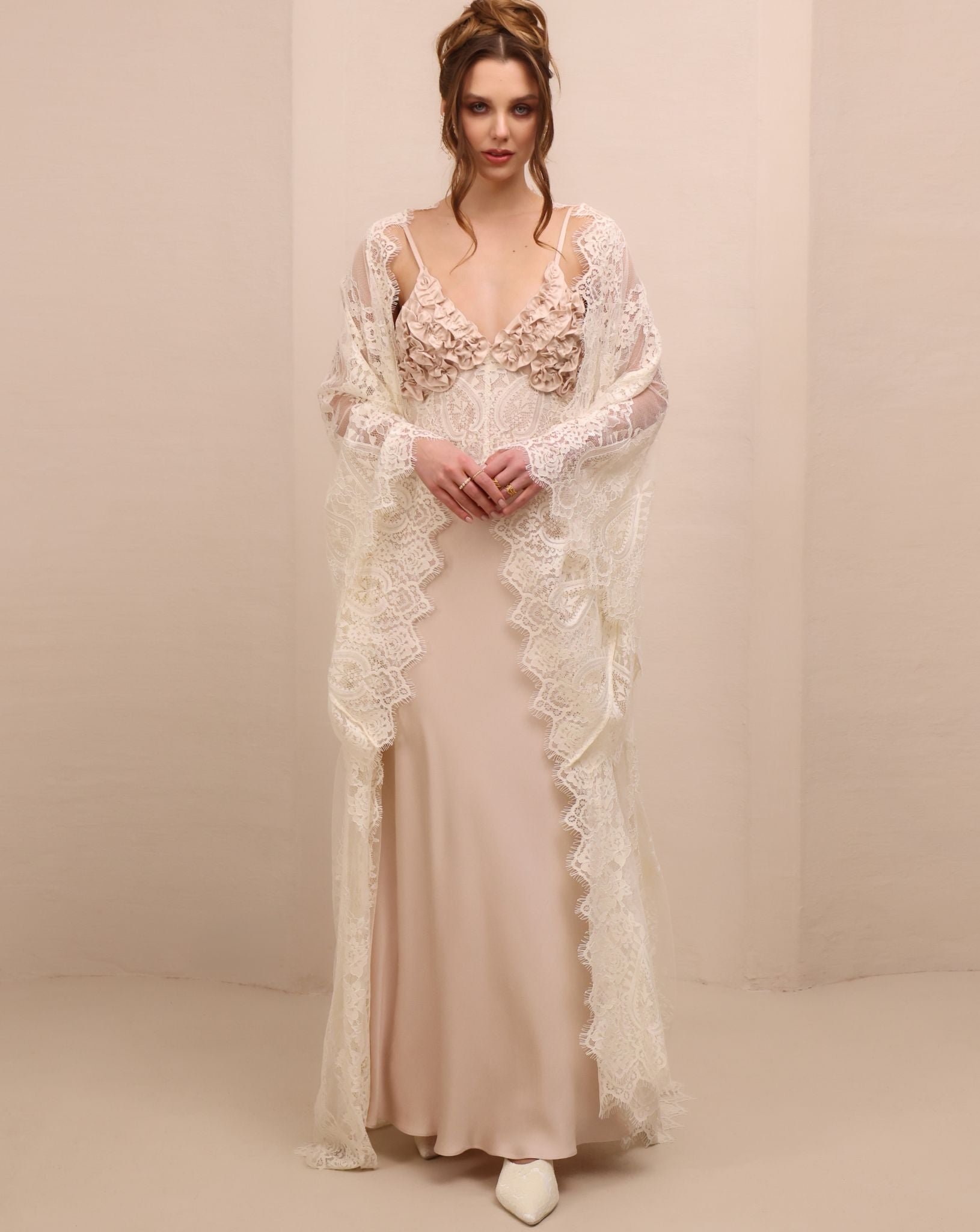 A serene static view of the duo, illustrating the perfect balance of texture, volume, and elongated silhouette.