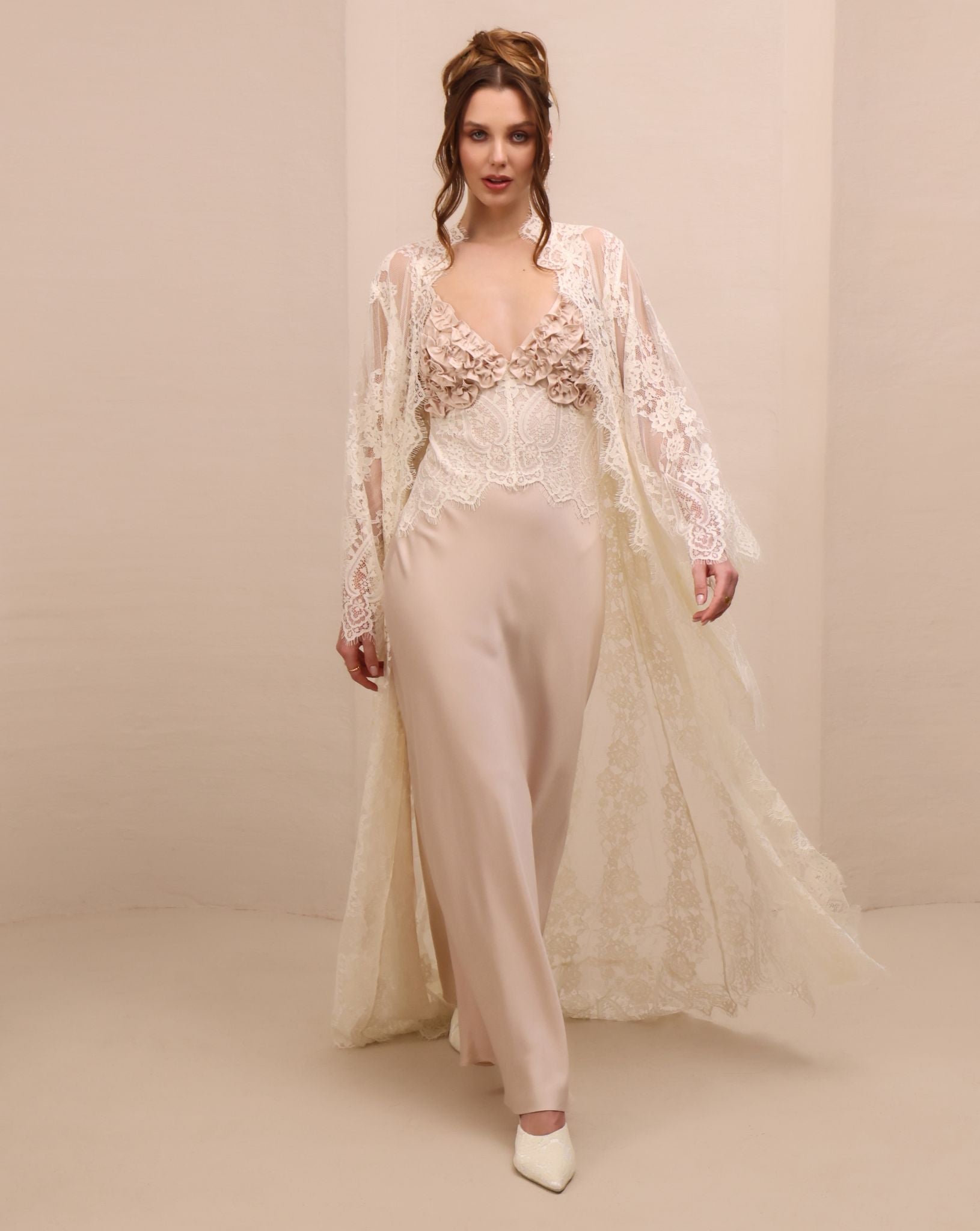 A dynamic motion shot of the Lace Robe and Nightgown Set, capturing the airy movement and the soft back train.