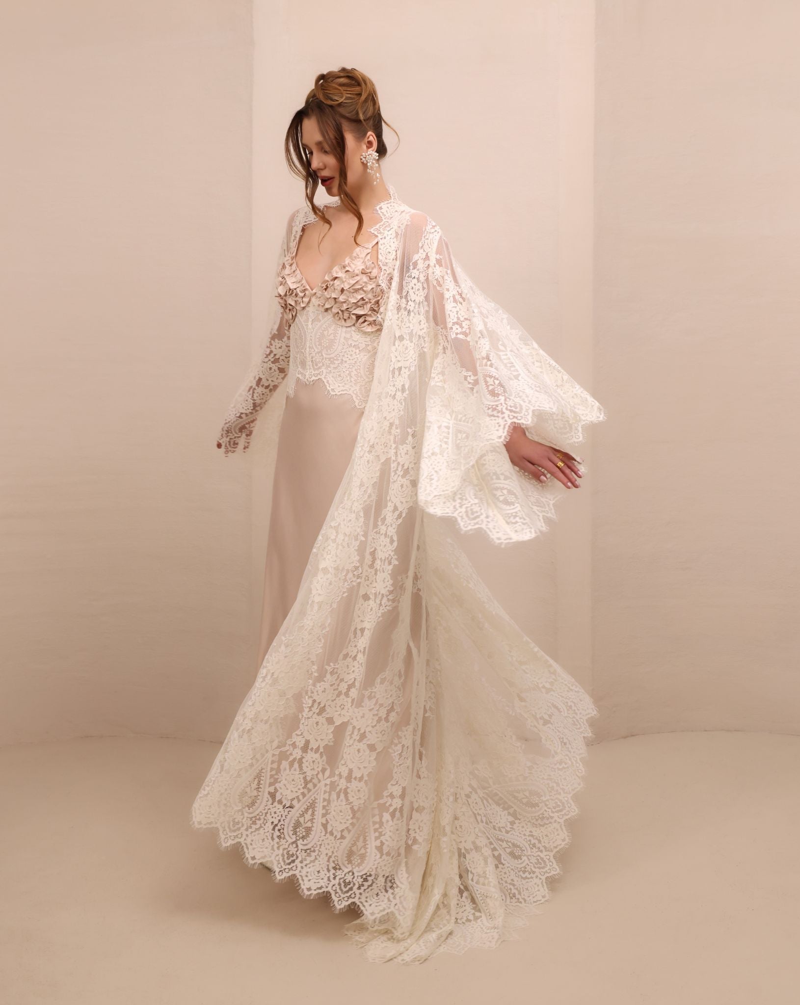 A spirited shot of the Robe and Nightgown Set twirling, capturing the movement of the lightweight lace finish.