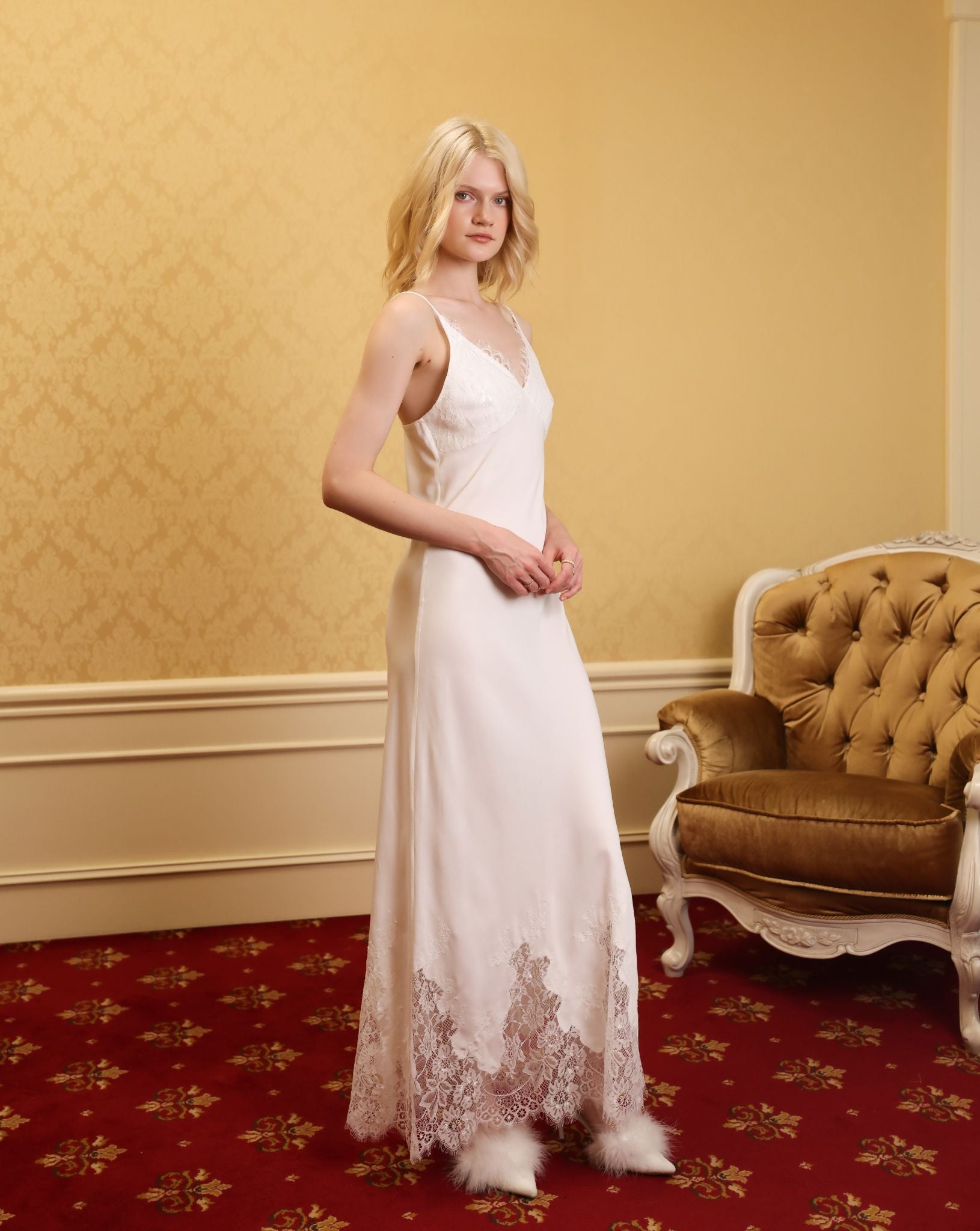 Side profile showing the lightweight cotton gown in motion, emphasizing its breathable and sophisticated design.