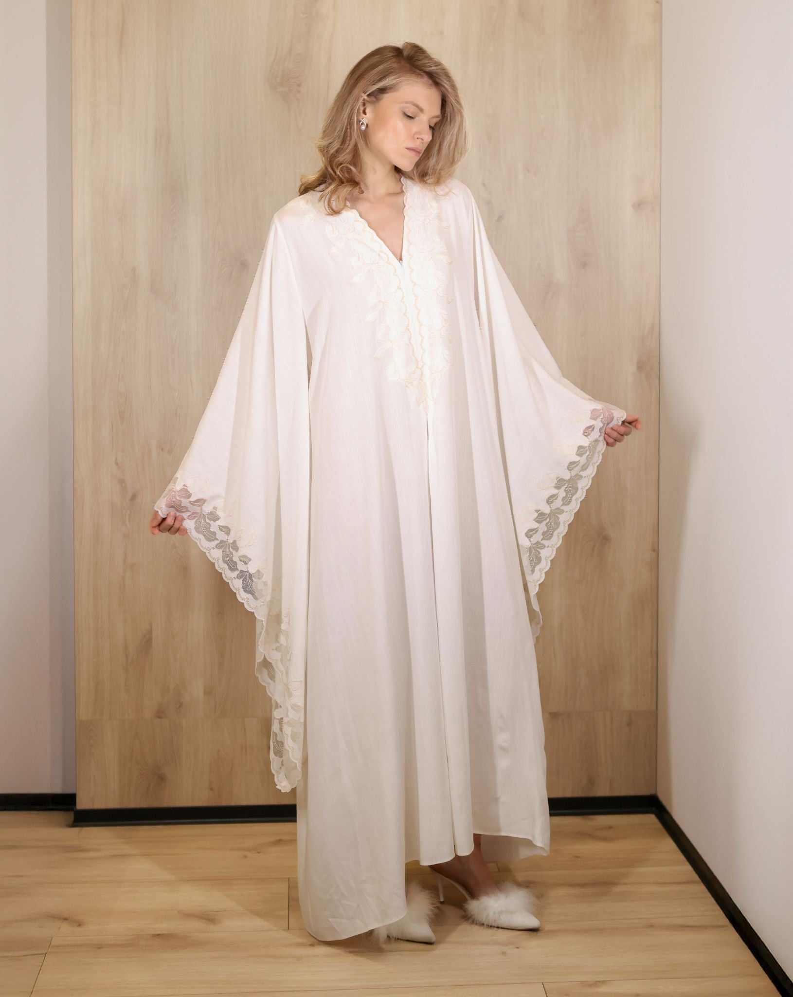 woman in minimal cotton kaftan with lace