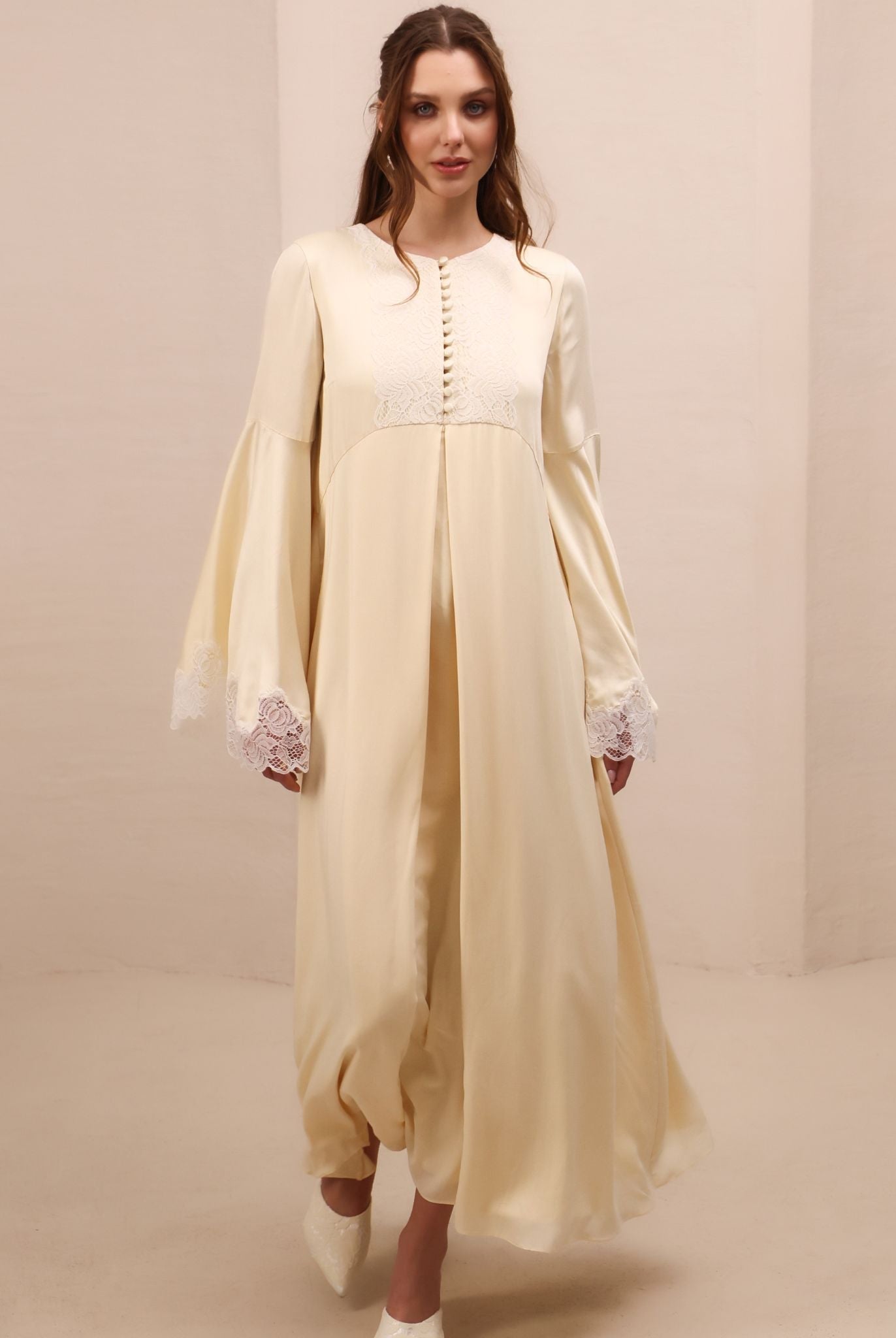 A close-up motion shot of the Modest Lounge Dress, capturing the fluid and graceful movement of the fabric.