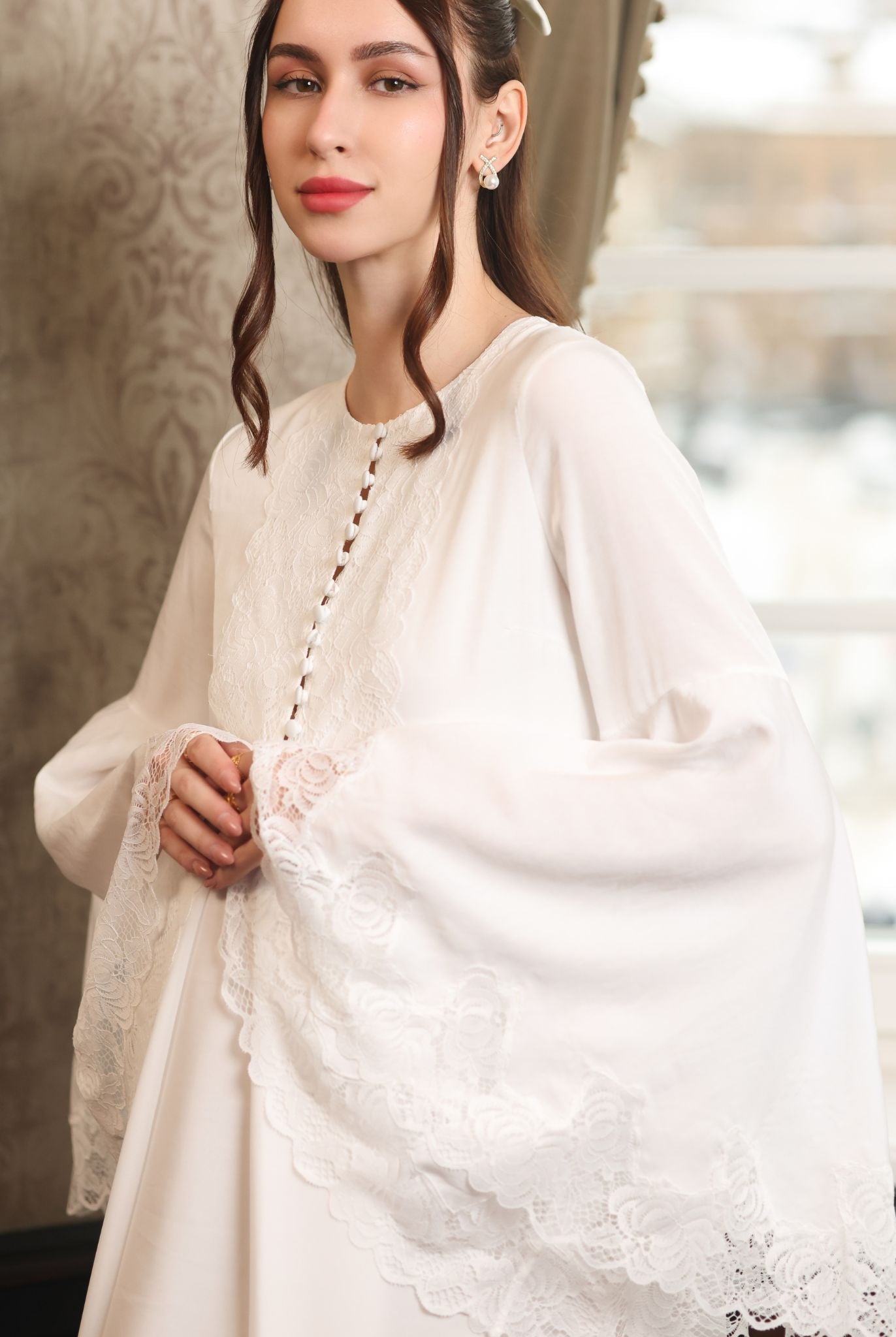 Mid-length shot focusing on the romantic lace-embellished sleeves and the practical buttoned breastfeeding access.