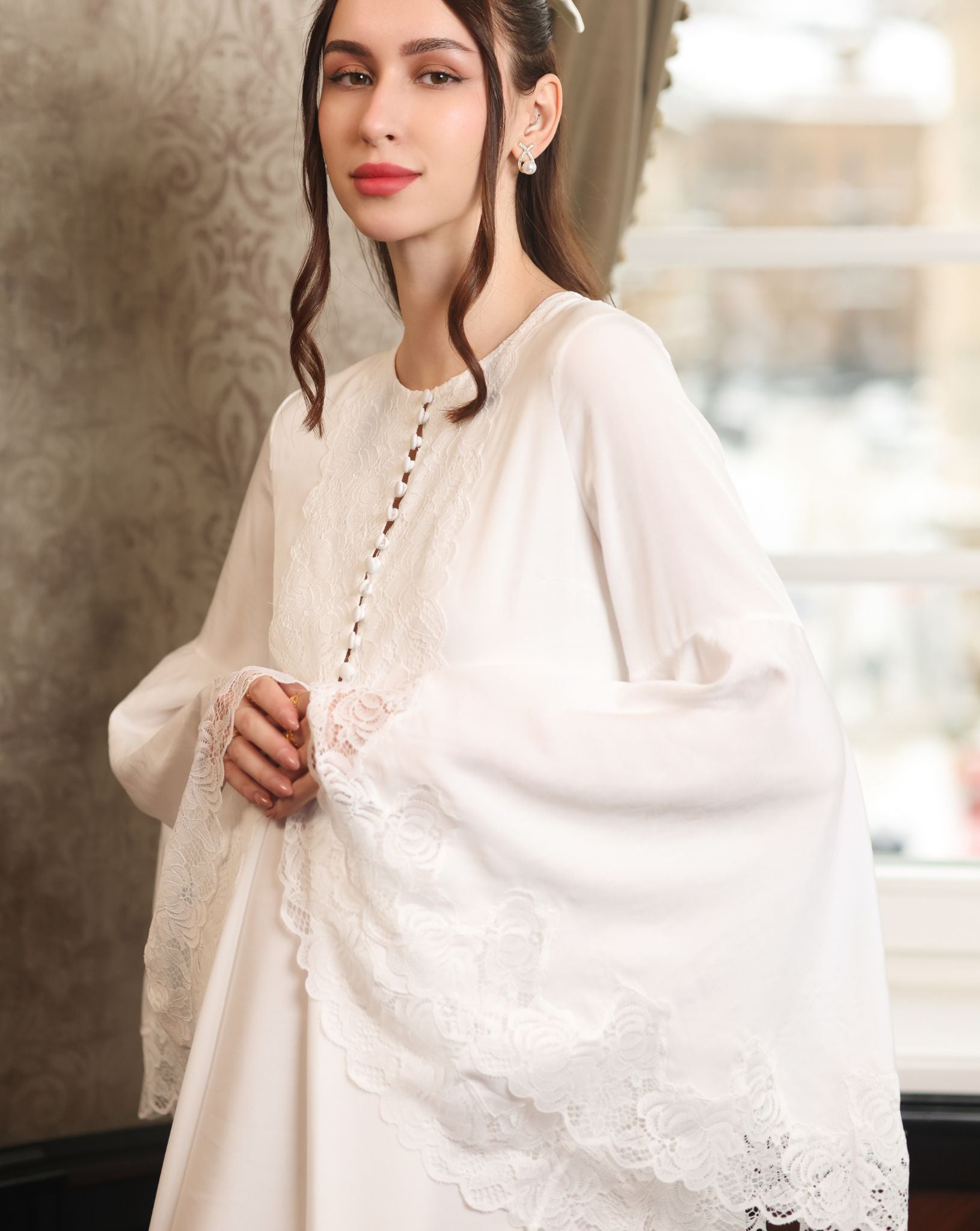 Mid-length shot focusing on the romantic lace-embellished sleeves and the practical buttoned breastfeeding access.