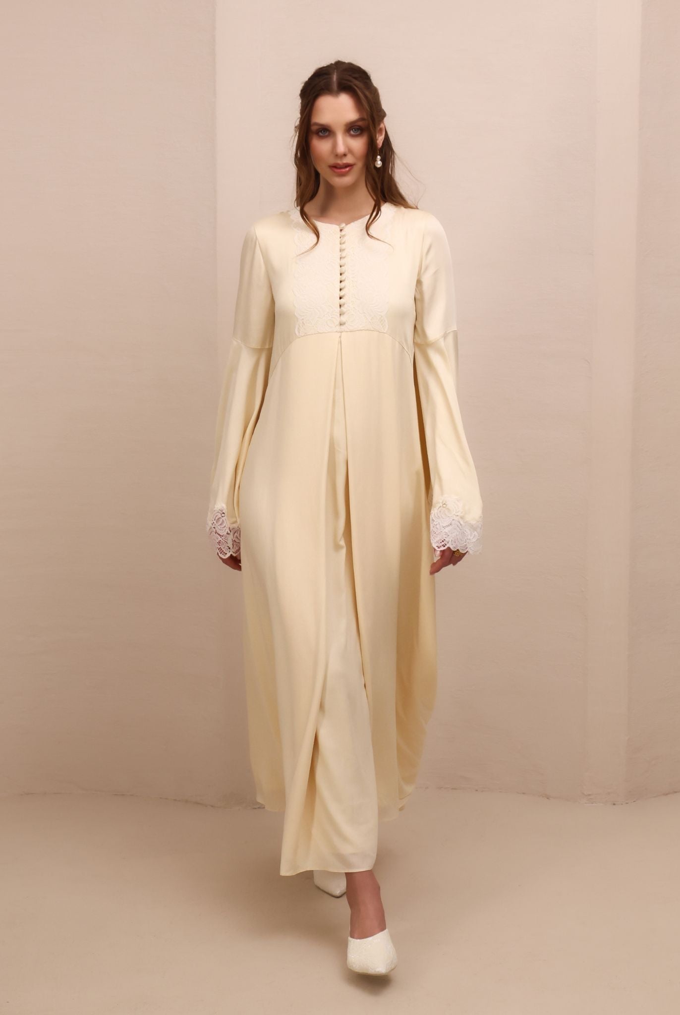 A full-length dynamic view of the flowing skirt, showing how the layered chiffon falls effortlessly to the floor.