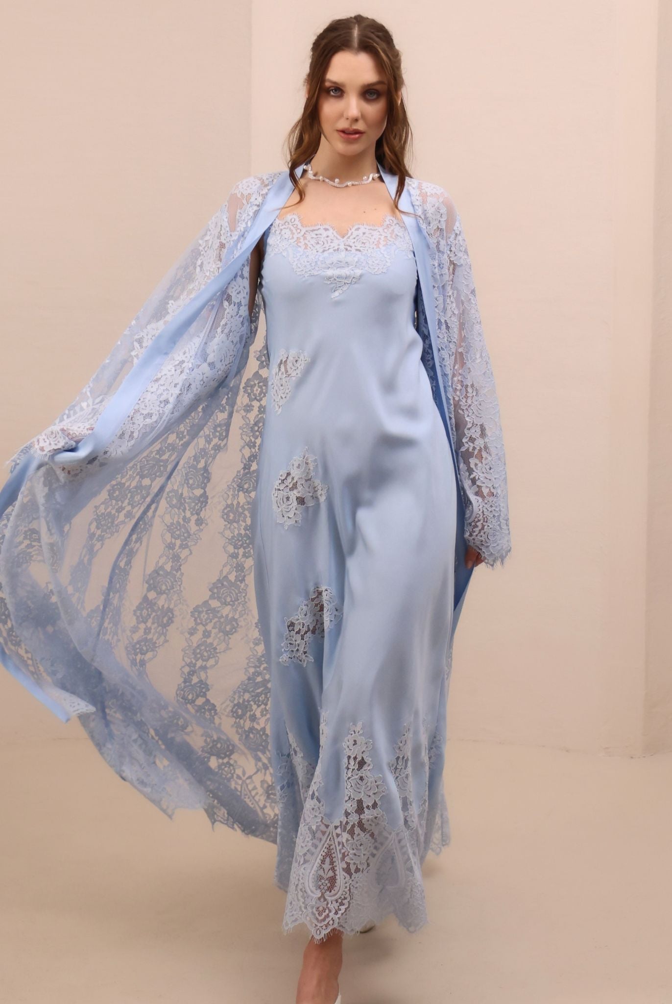 A spirited shot of the attire in motion, illustrating the artistic charm of the scattered lace appliqués.