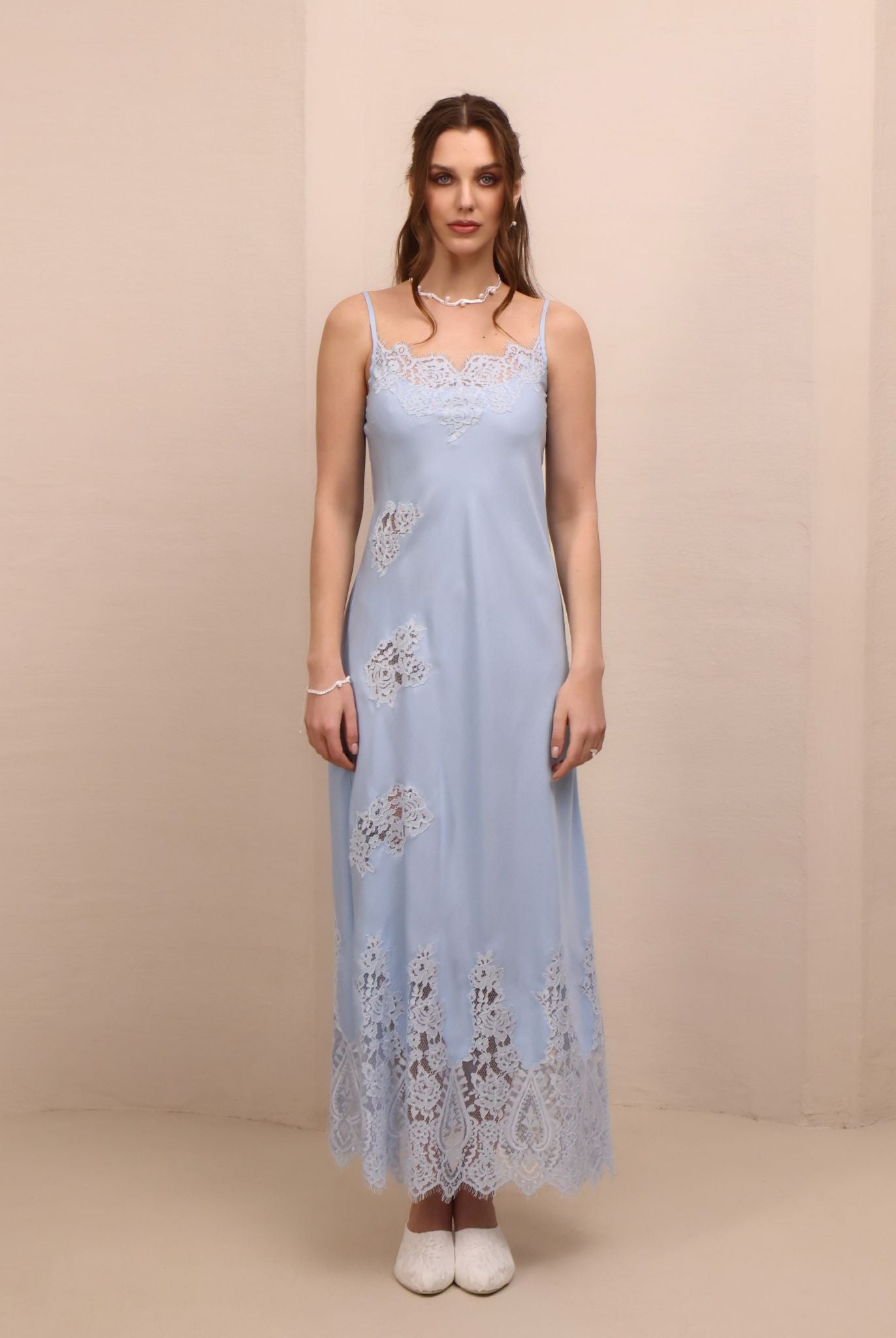 Frontal view of the nightgown, showcasing the scattered lace appliqués through the body and the hem.