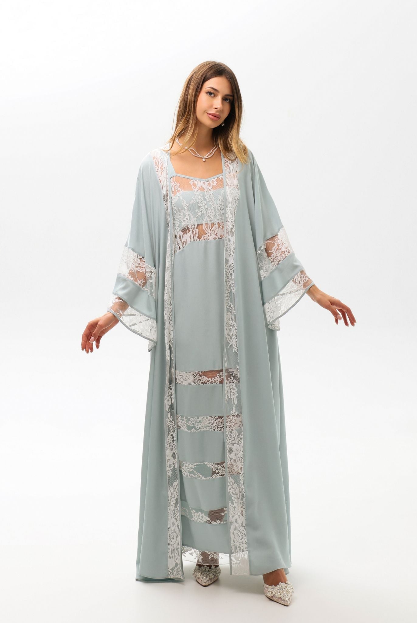 A full-length shot capturing the airy silhouette and the beautiful drape of the flowing viscose robe.