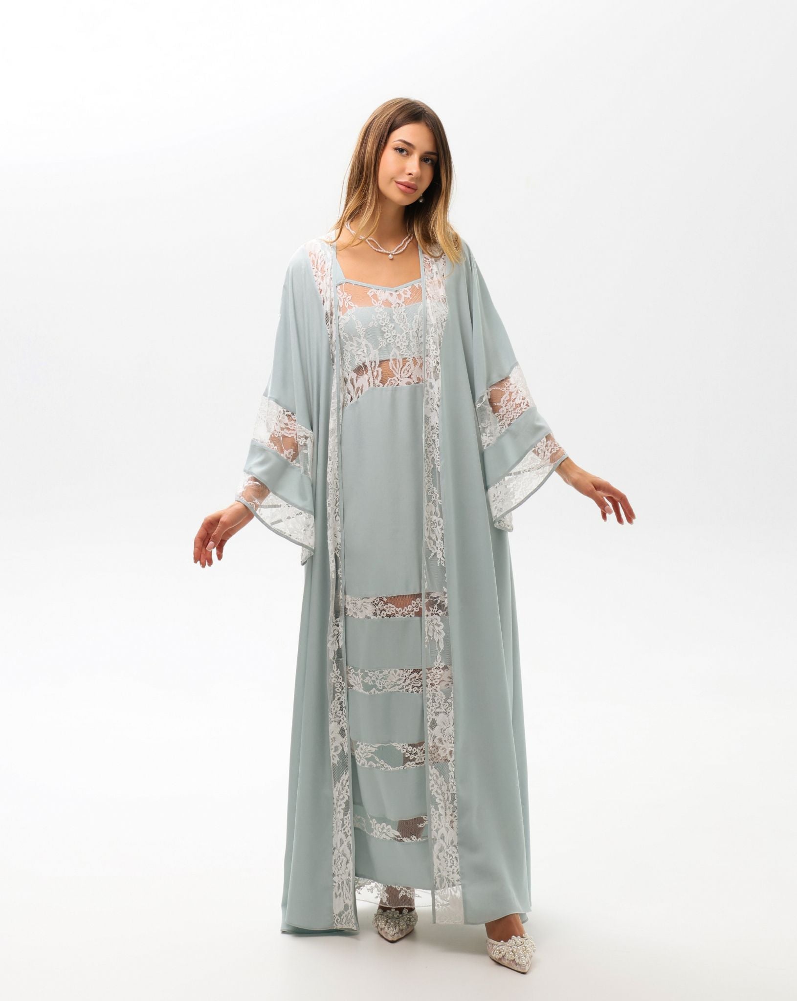 A full-length shot capturing the airy silhouette and the beautiful drape of the flowing viscose robe.
