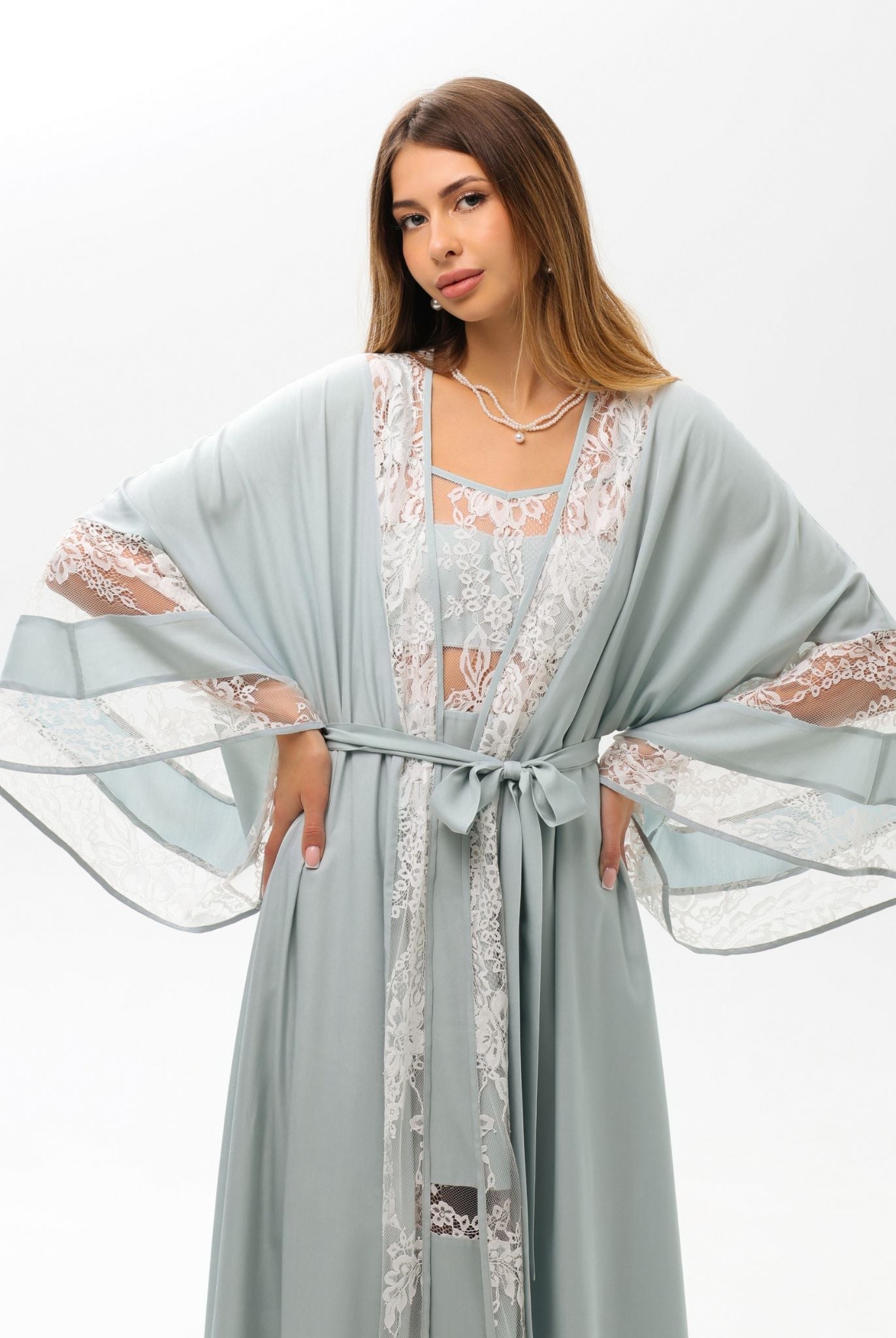 A poised mid-length shot of the Robe and Nightgown Set, featuring a sash tie for an adjustable, flattering fit.