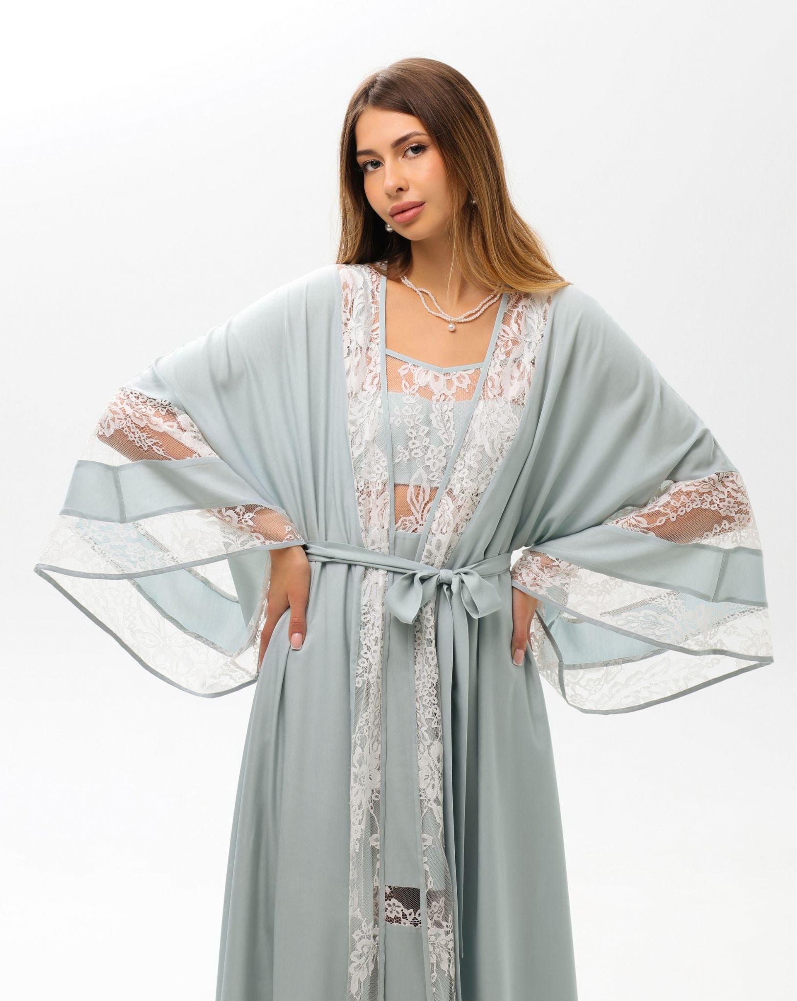 A poised mid-length shot of the Robe and Nightgown Set, featuring a sash tie for an adjustable, flattering fit.