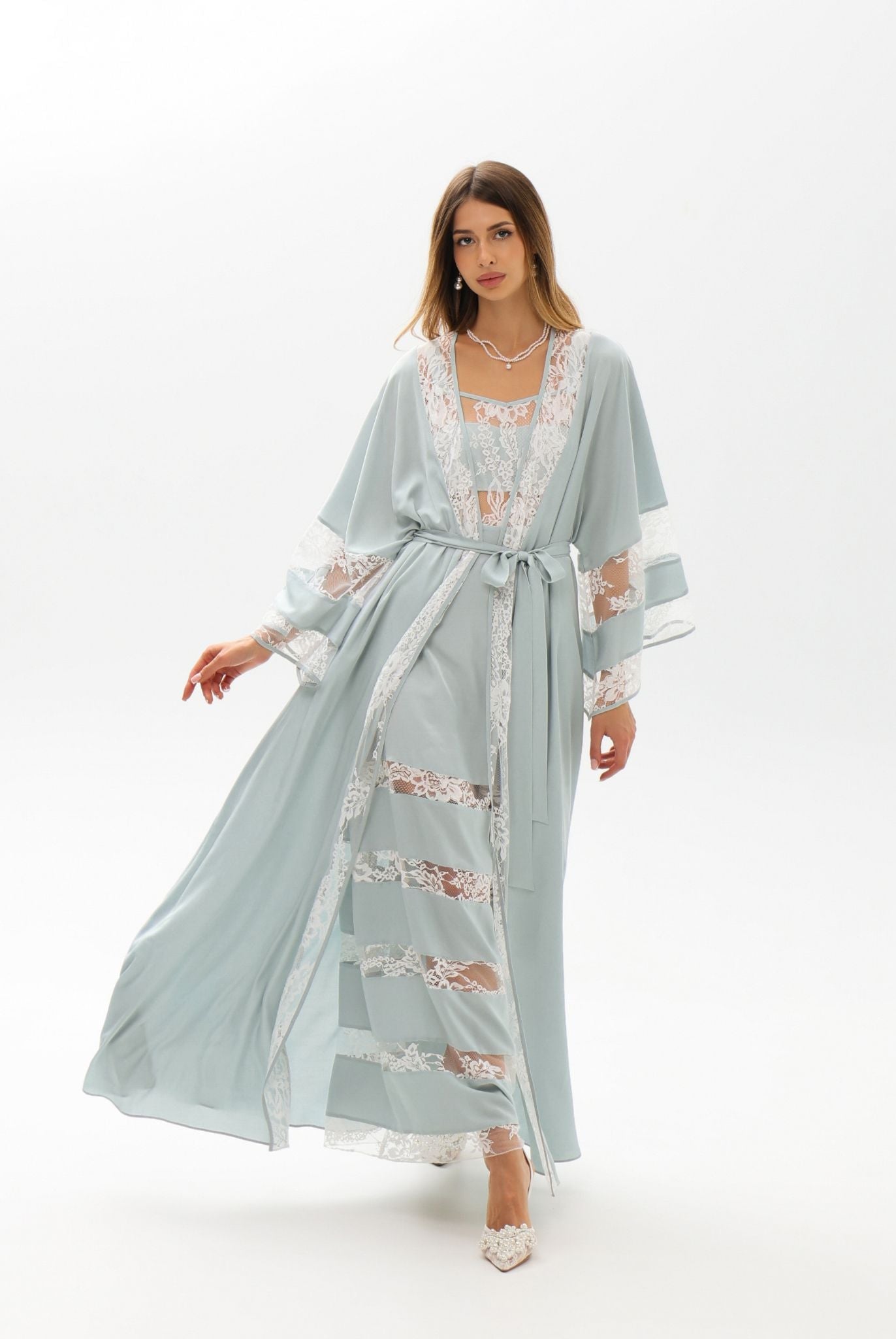 A full-length motion shot of the ensemble, designed for quiet moments of beauty and comfort at home.