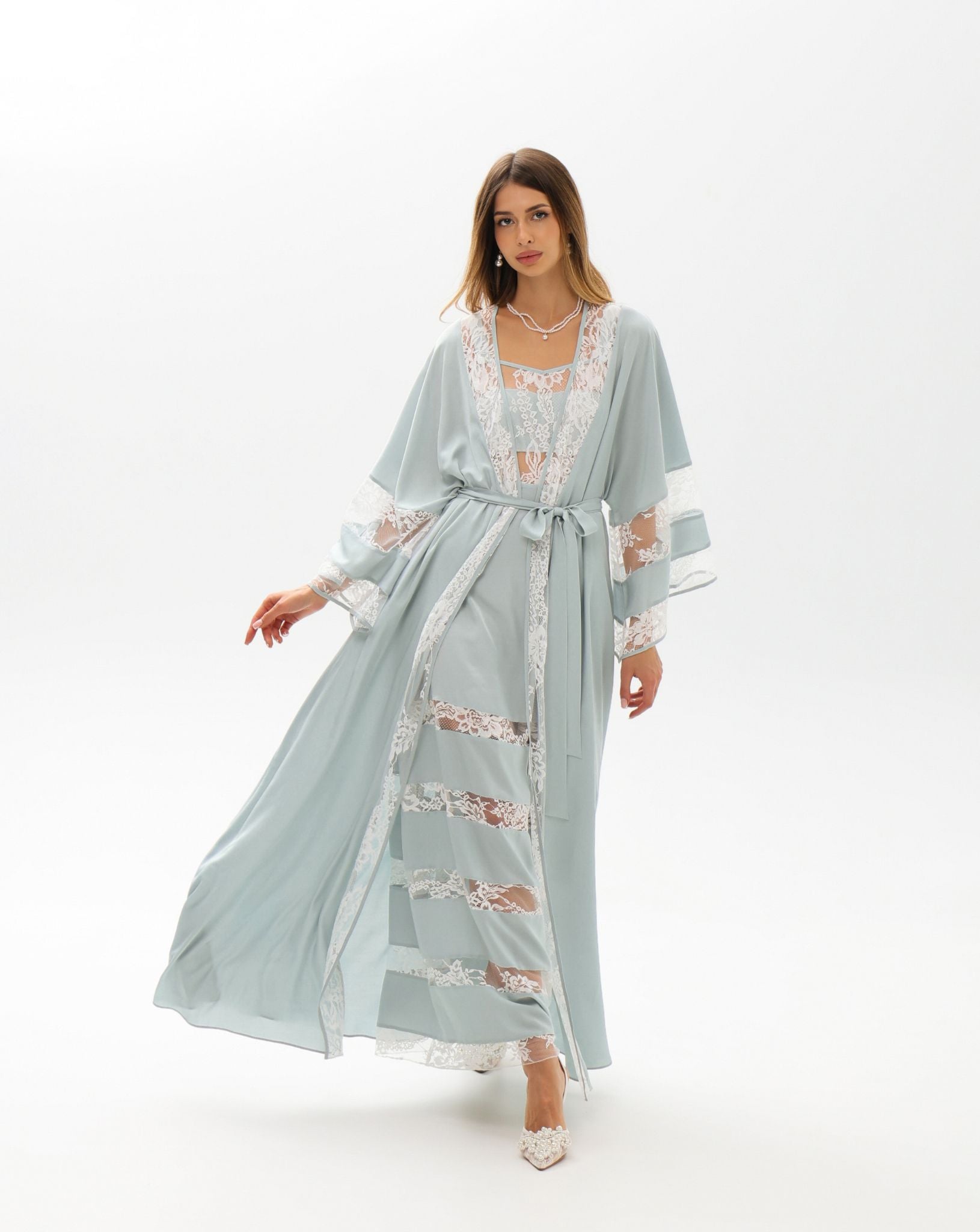 A full-length motion shot of the ensemble, designed for quiet moments of beauty and comfort at home.