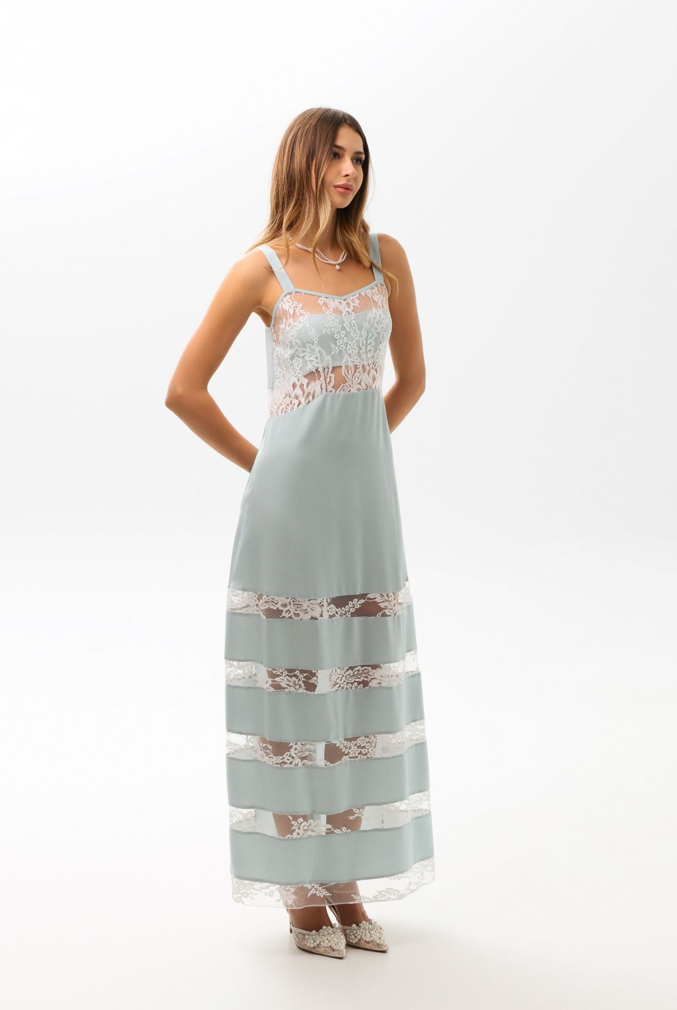 Side perspective of the sleeveless nightdress, highlighting the lightweight feel and refined, understated luxury.