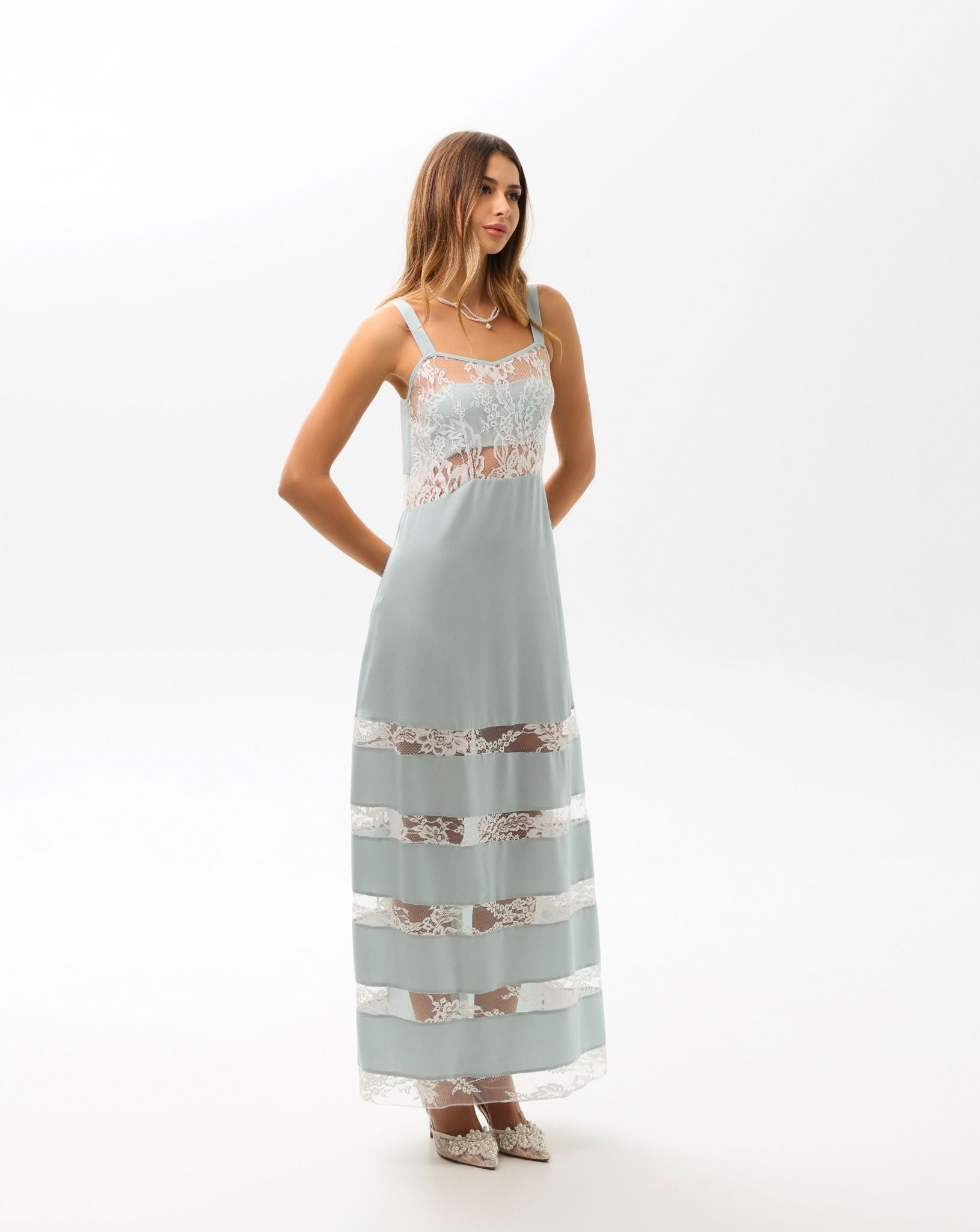 Side perspective of the sleeveless nightdress, highlighting the lightweight feel and refined, understated luxury.