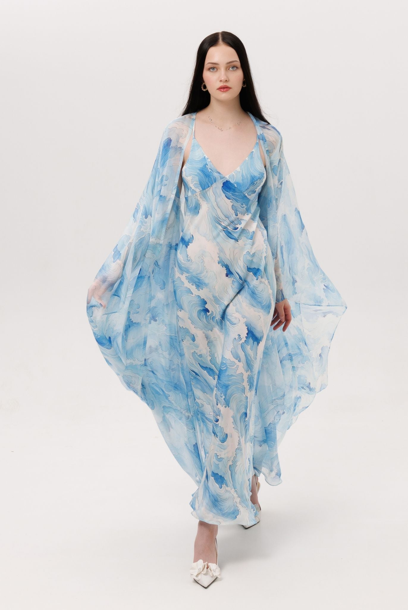 A full-length shot of the Silk Robe and Nightgown Set in motion, capturing the fluid and wave-like rhythm of pure silk.