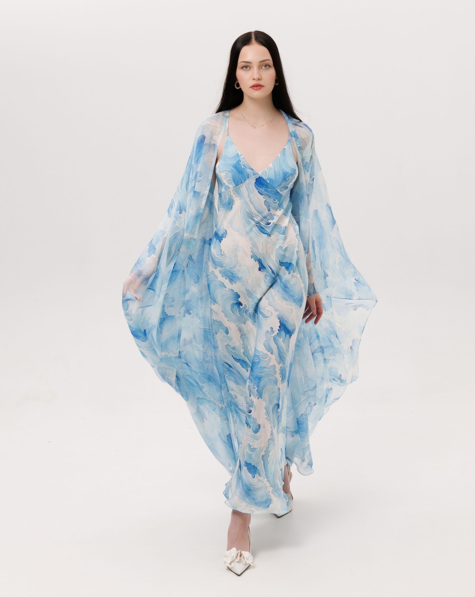 A full-length shot of the Silk Robe and Nightgown Set in motion, capturing the fluid and wave-like rhythm of pure silk.