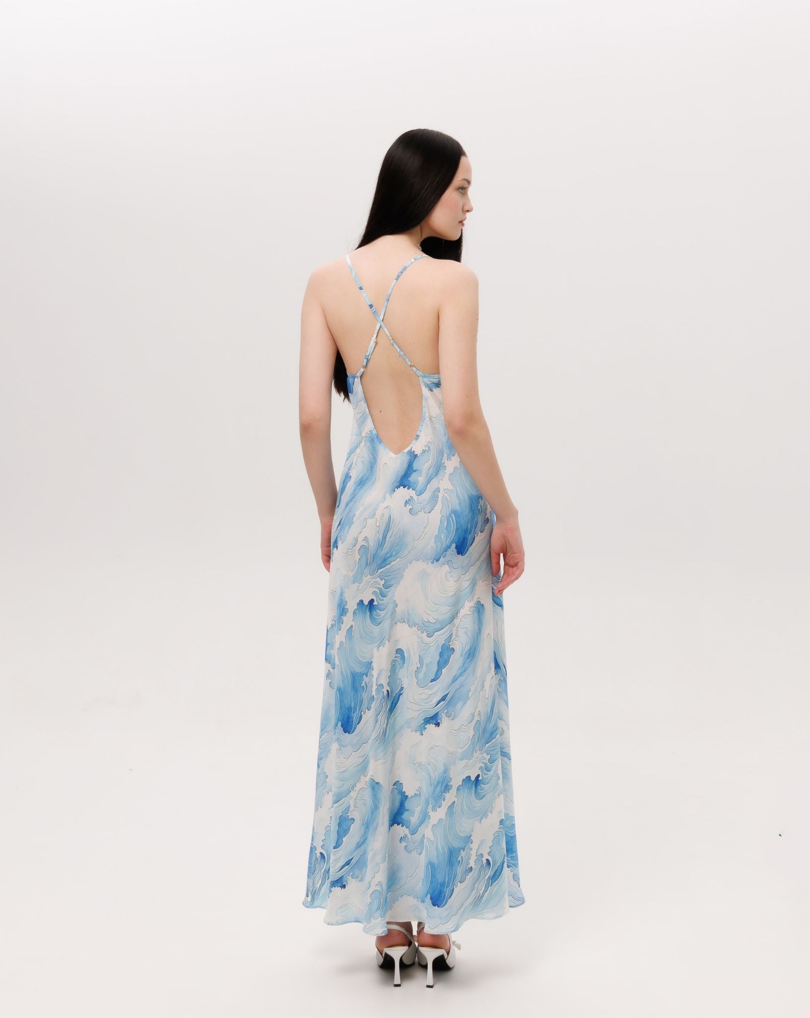 Rear view of the silk nightdress showcasing the mid-open V-cut back and crisscross straps with length regulation.
