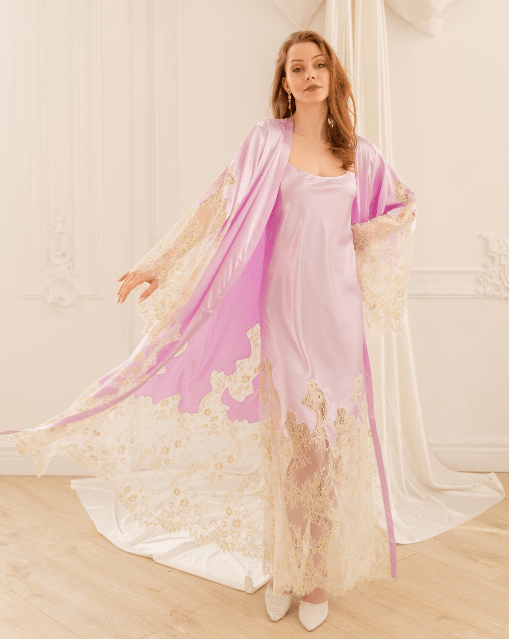 A dynamic motion shot of the Satin Robe and Nightgown Set, capturing the flowing robe and ornate lace trim as it moves.