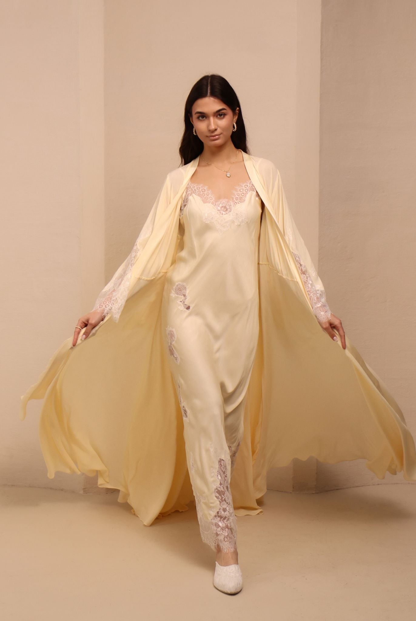 A motion shot of the Robe and Nightgown Set, capturing the lightweight fabric and floor-length silhouette.