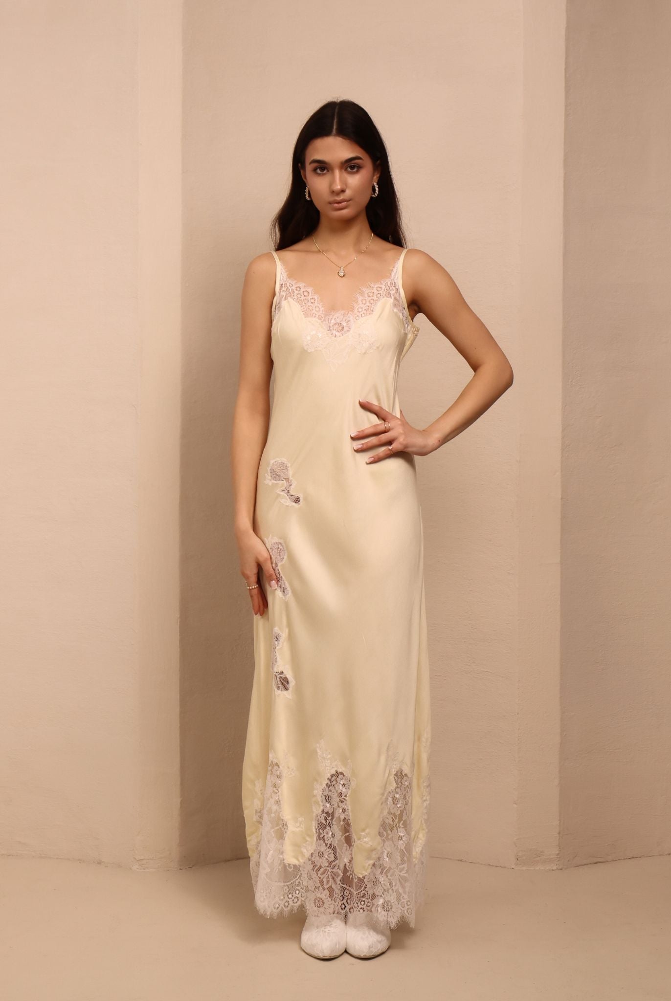 Frontal view of the nightgown with thin straps and lace around the neck, illustrating a soft and natural fit.