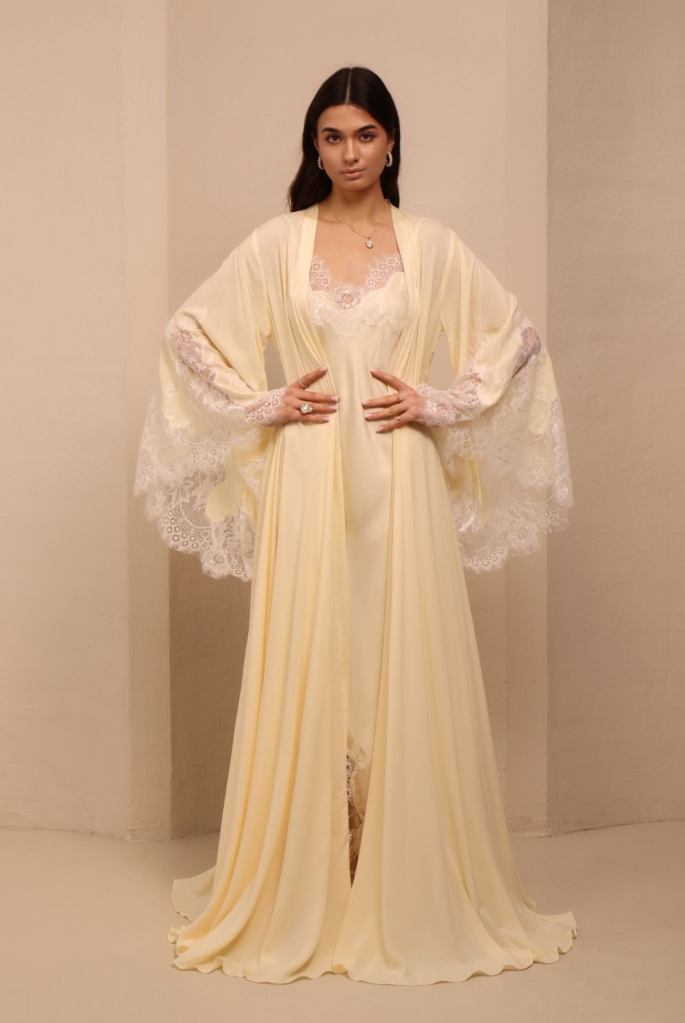 A frontal shot of the tied robe, showcasing wide sleeves adorned with pretty lace and a flattering waistline.