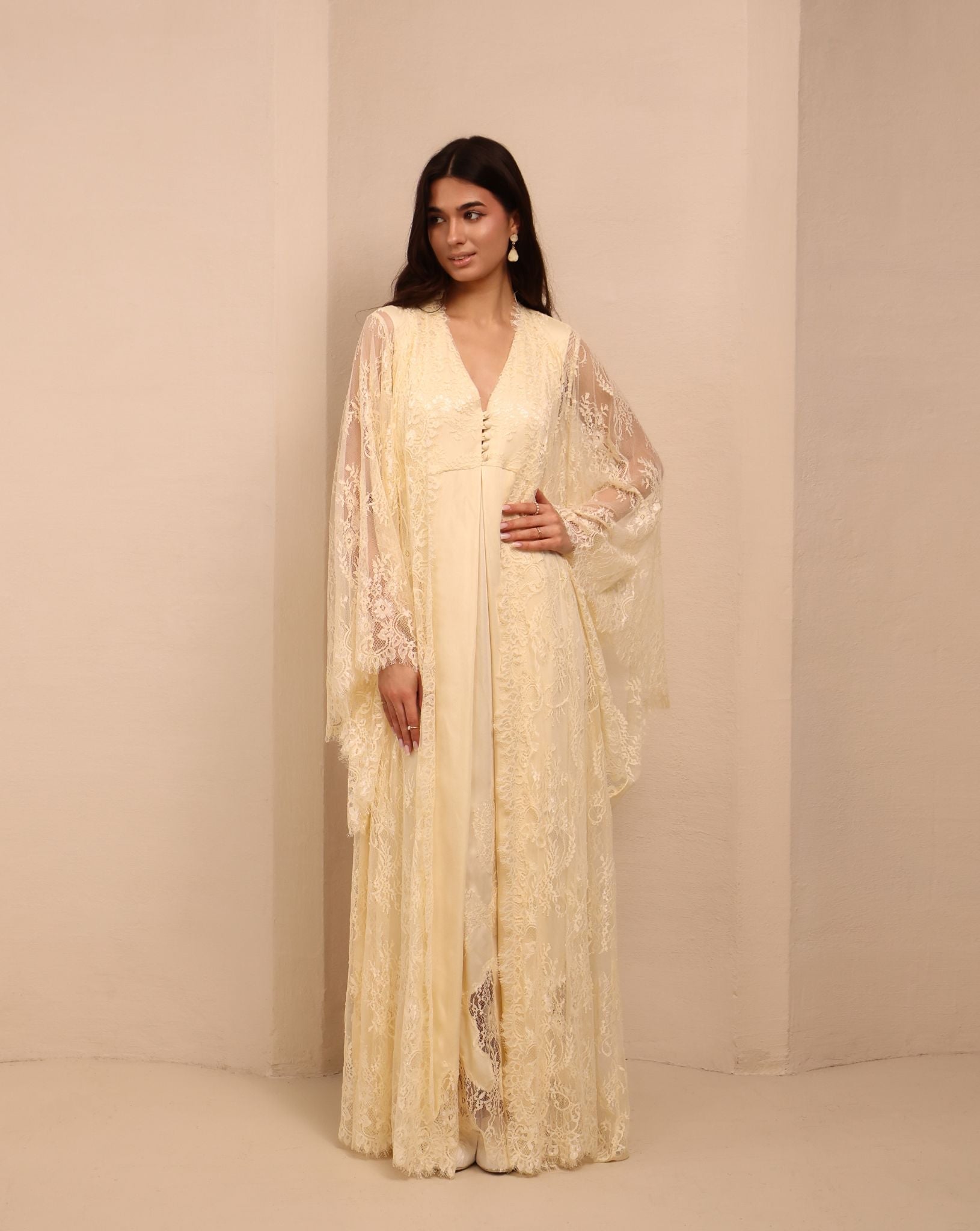 A relaxed view of the open lace robe, capturing a sophisticated look perfect for resting or quiet time with a baby.