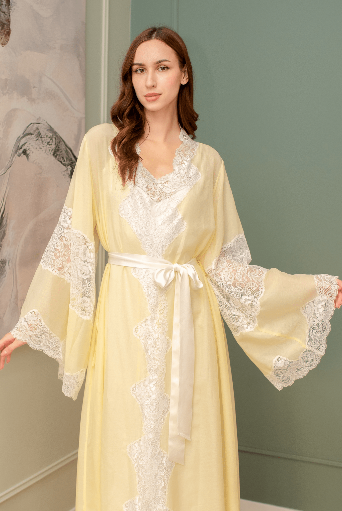 Mid-length view of the belted robe over the silk dress, creating a special atmosphere of feminine grace at home.