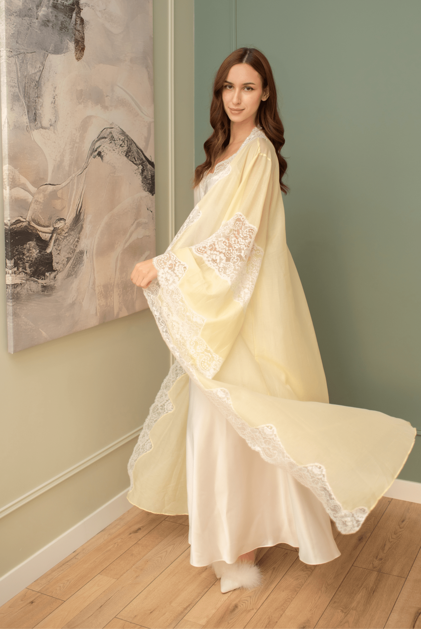 A dynamic shot of the ensemble in motion, capturing the flowing chiffon robe as it moves silently with every step.