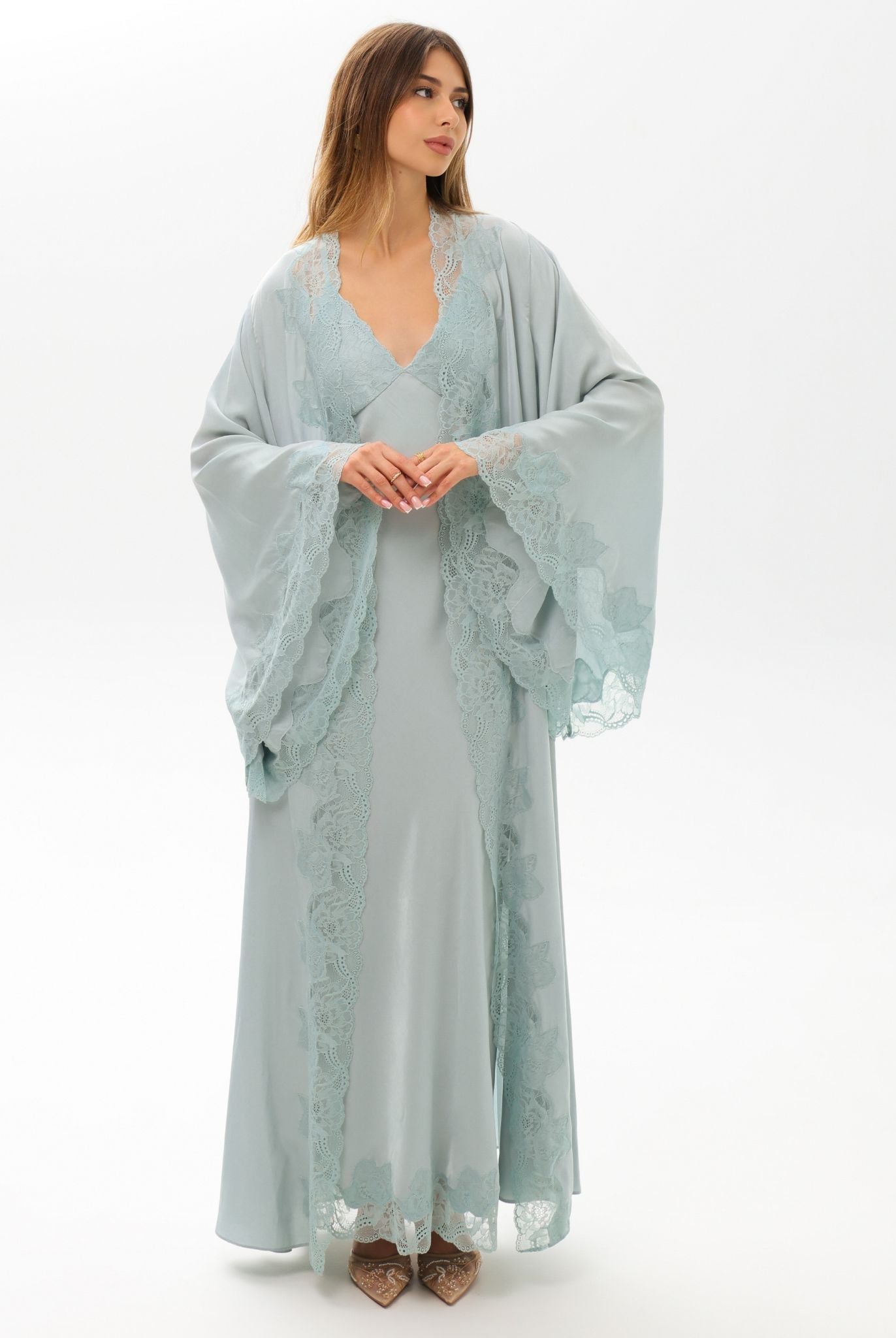 A frontal shot featuring floral lace embellishment on the sleeves, showcasing the essence of soft femininity.