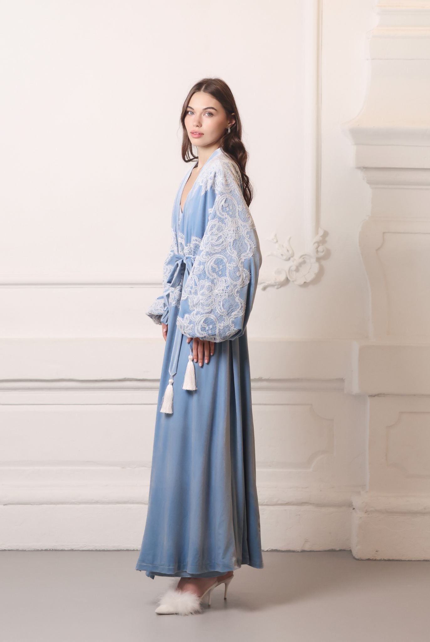 Front-side perspective of the blue velvet wrap, highlighting the soft texture and luxurious essential style.