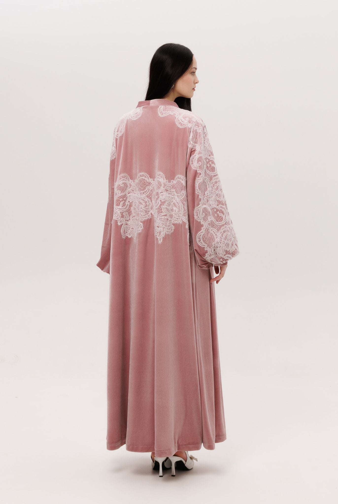 Back view of the floor-length velvet robe, showing the soft drama and poetic movement of the material.
