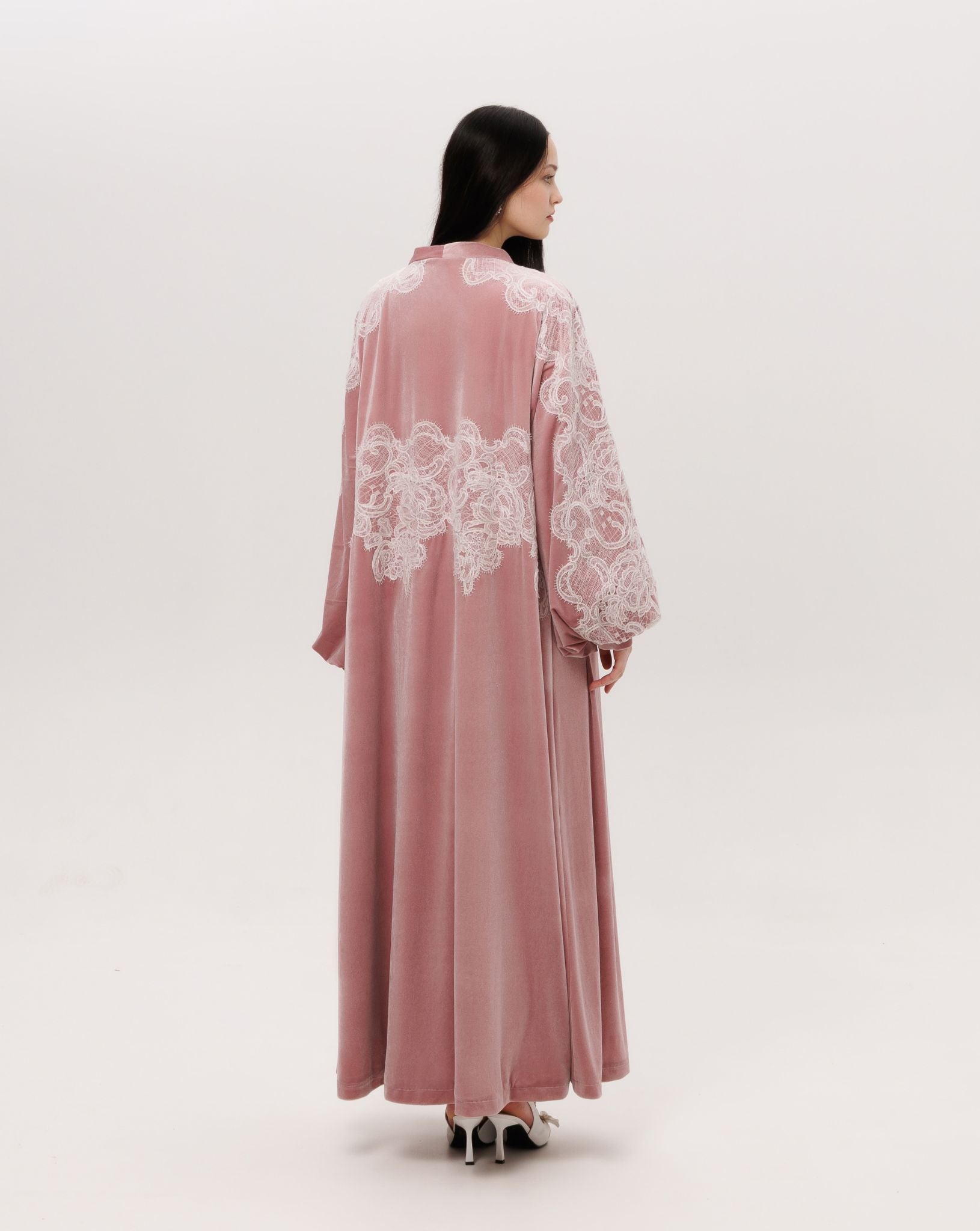 Back view of the floor-length velvet robe, showing the soft drama and poetic movement of the material.