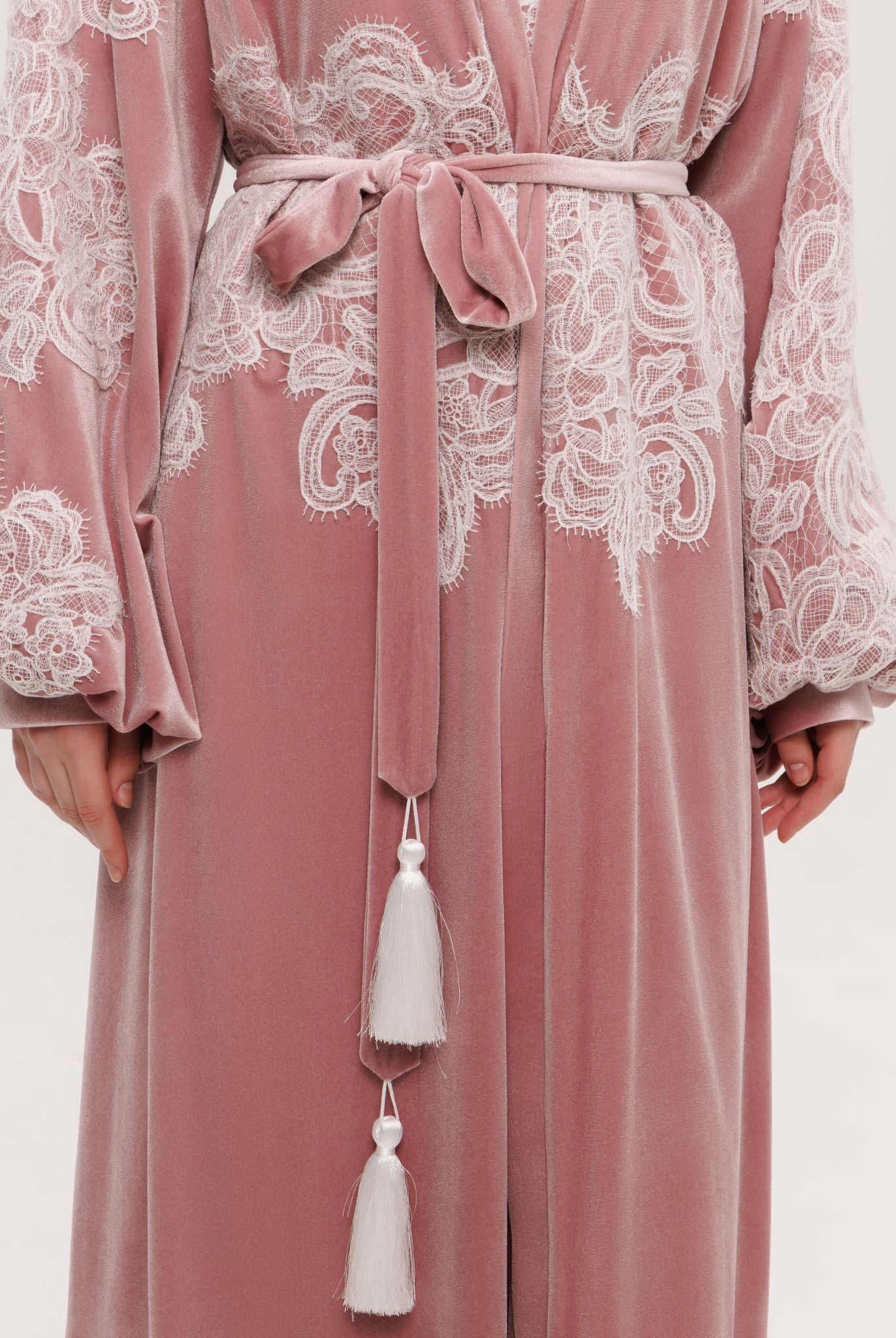 Detailed view of the voluminous balloon sleeves embellished with delicate ivory corded lace inserts.