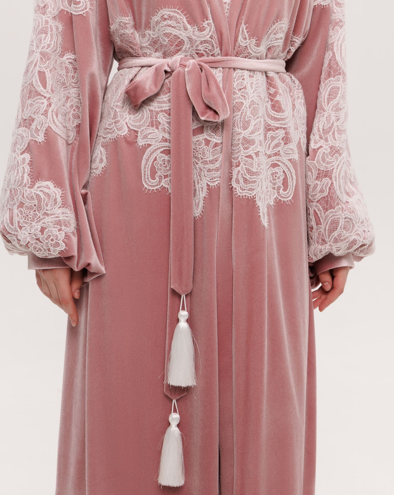 Detailed view of the voluminous balloon sleeves embellished with delicate ivory corded lace inserts.