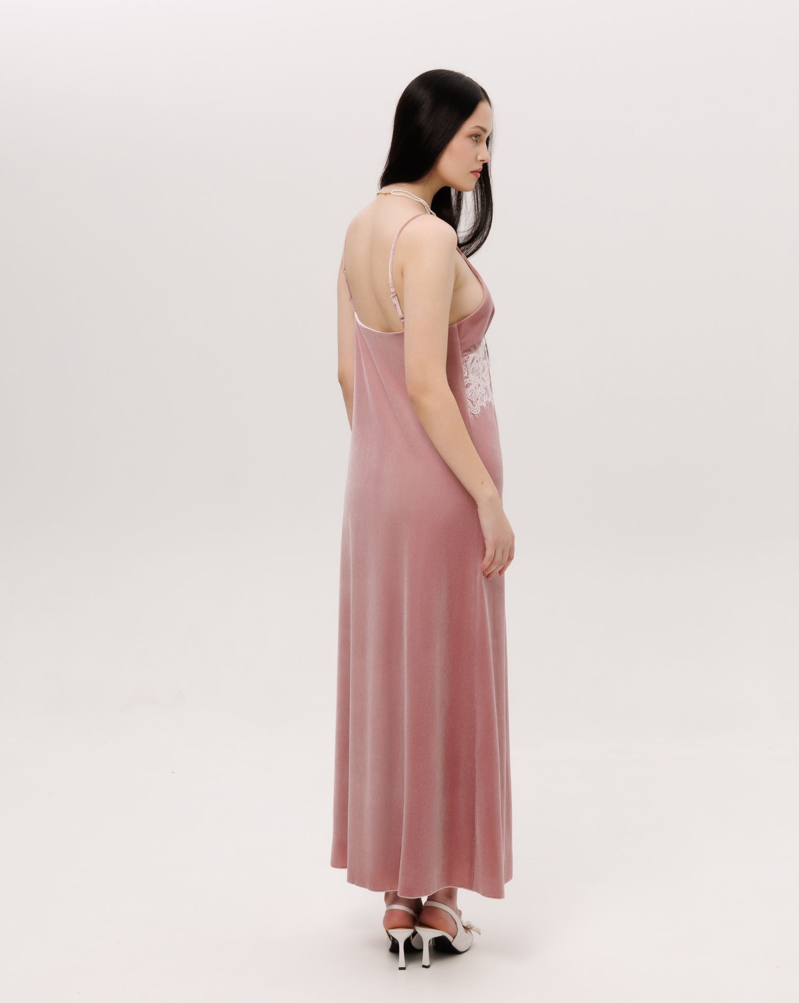 Side perspective of the long nightdress, illustrating the graceful weight and effortless grandeur.