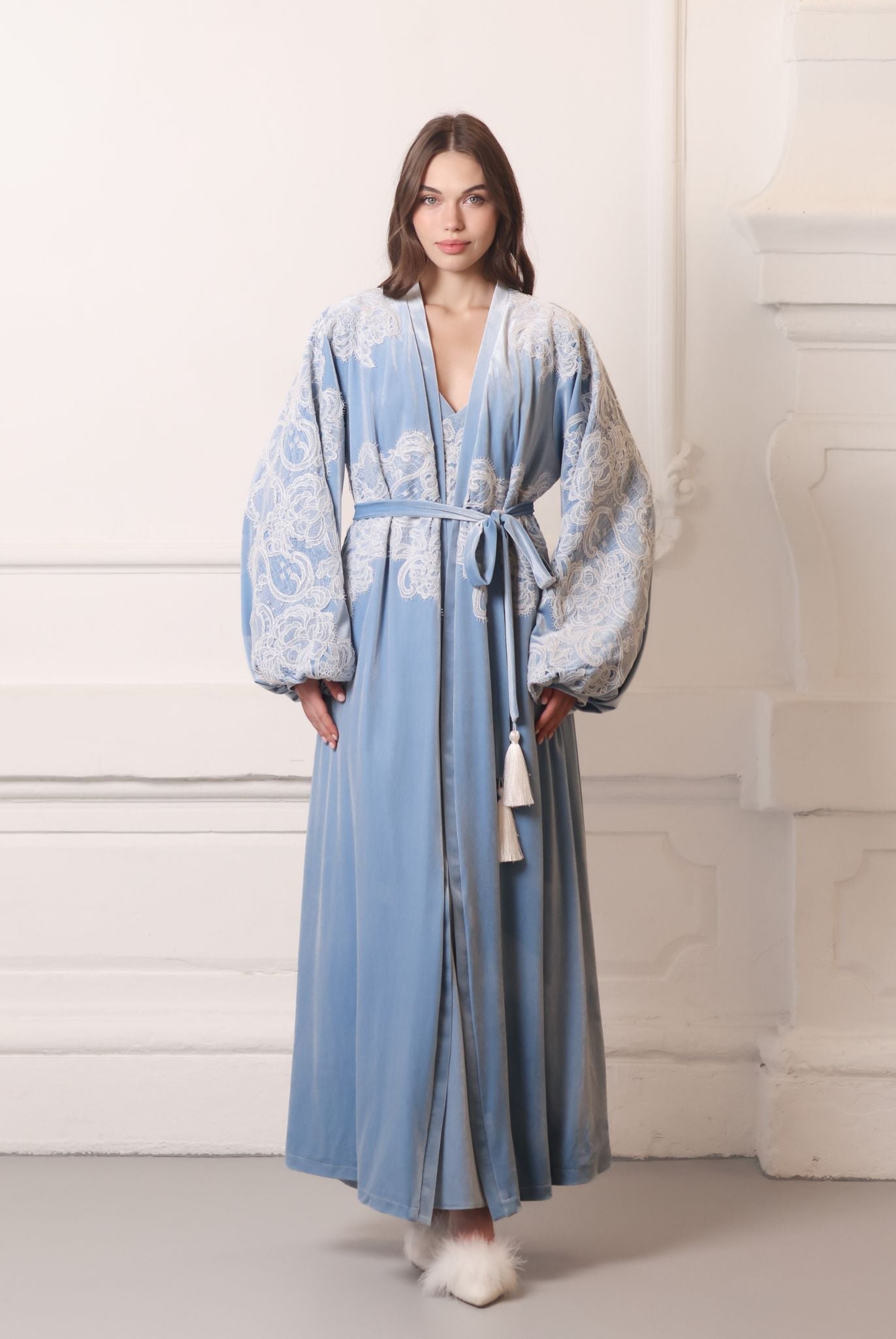 Full-length view of a plush blue ensemble featuring ivory corded lace and a sophisticated long-line design.