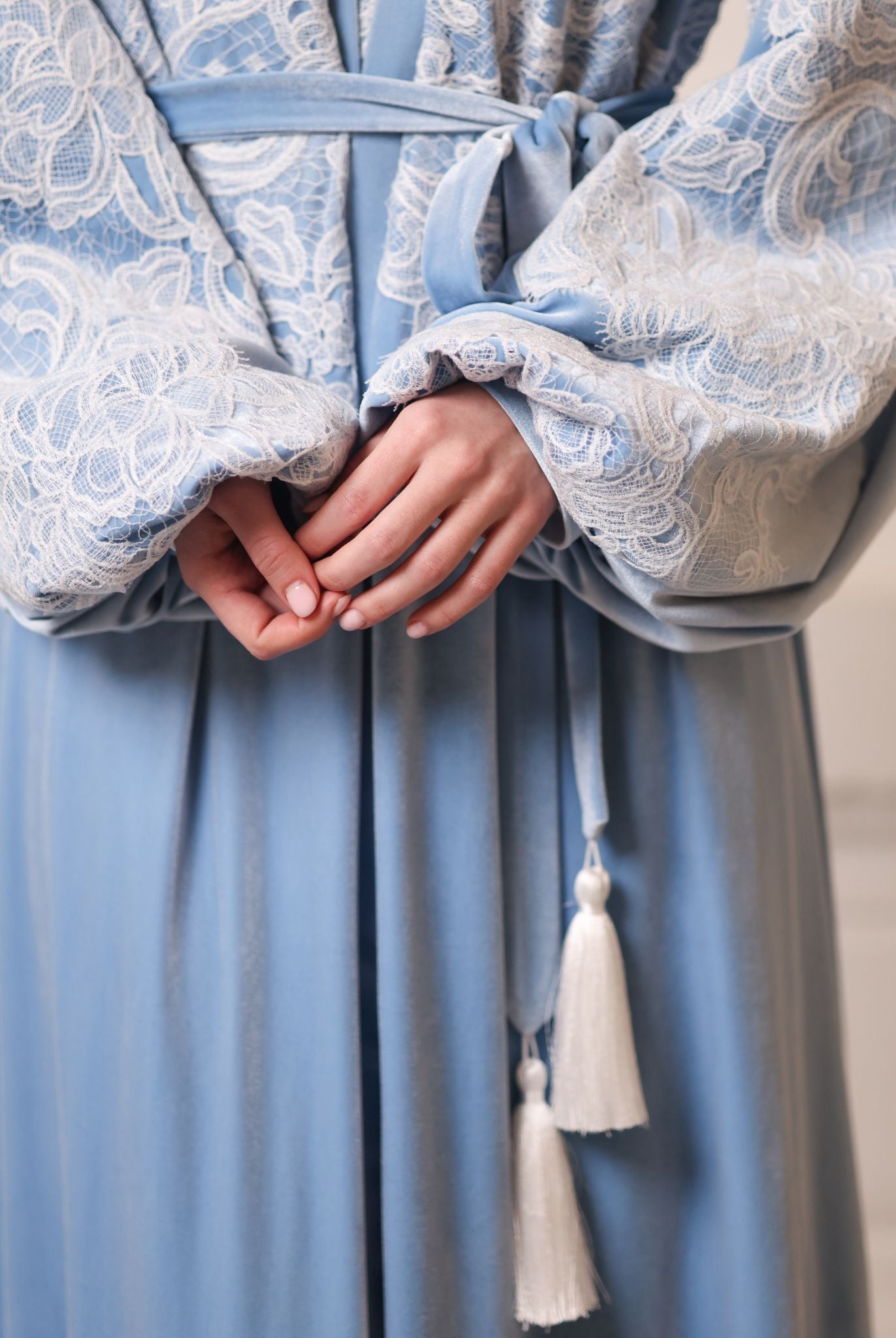 Artistic focus on the waistline belt, highlighting the warmth and weight of the high-quality winter velvet.